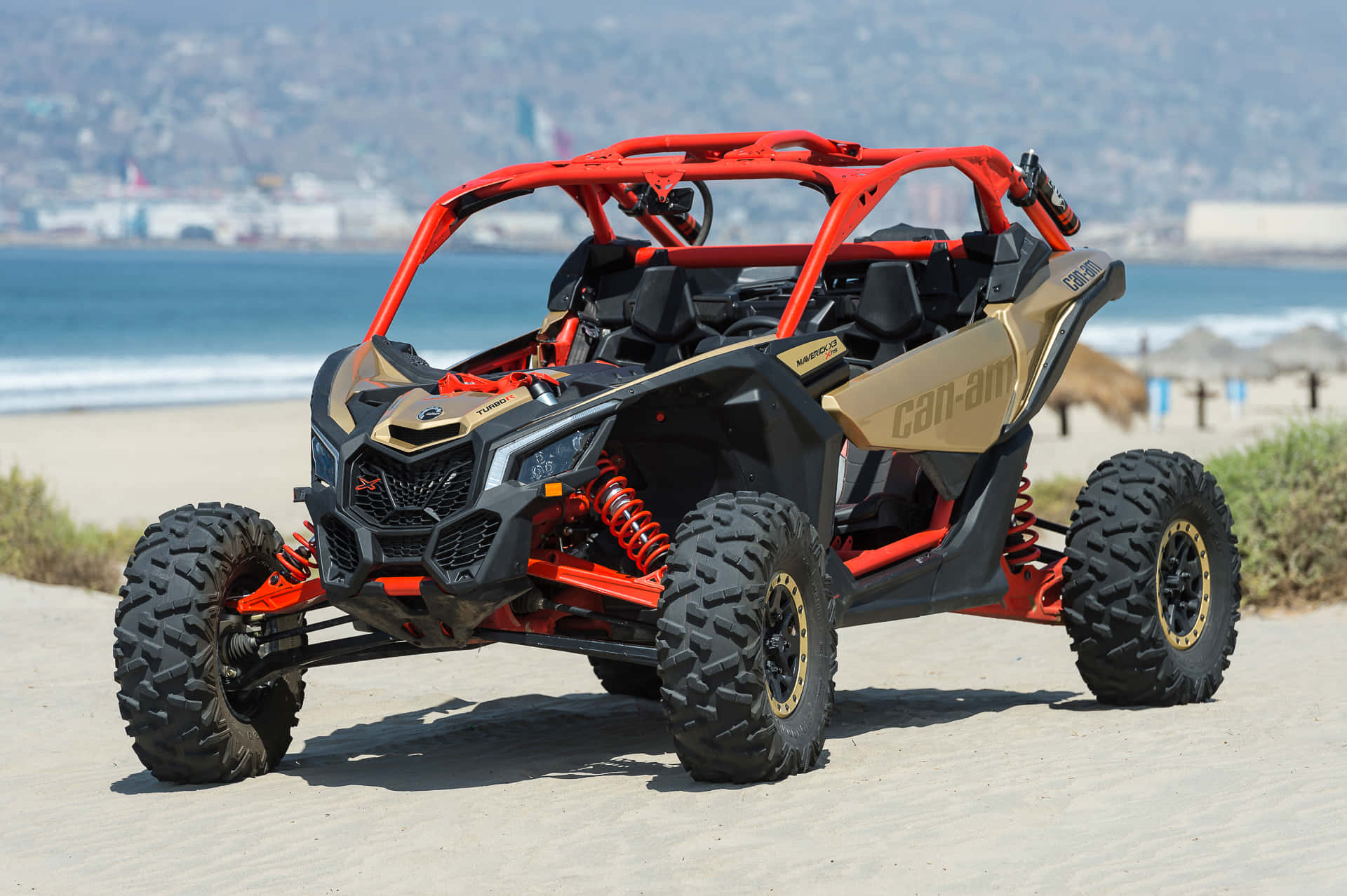 Red Black Can Am Offroad Vehicle Beach Background