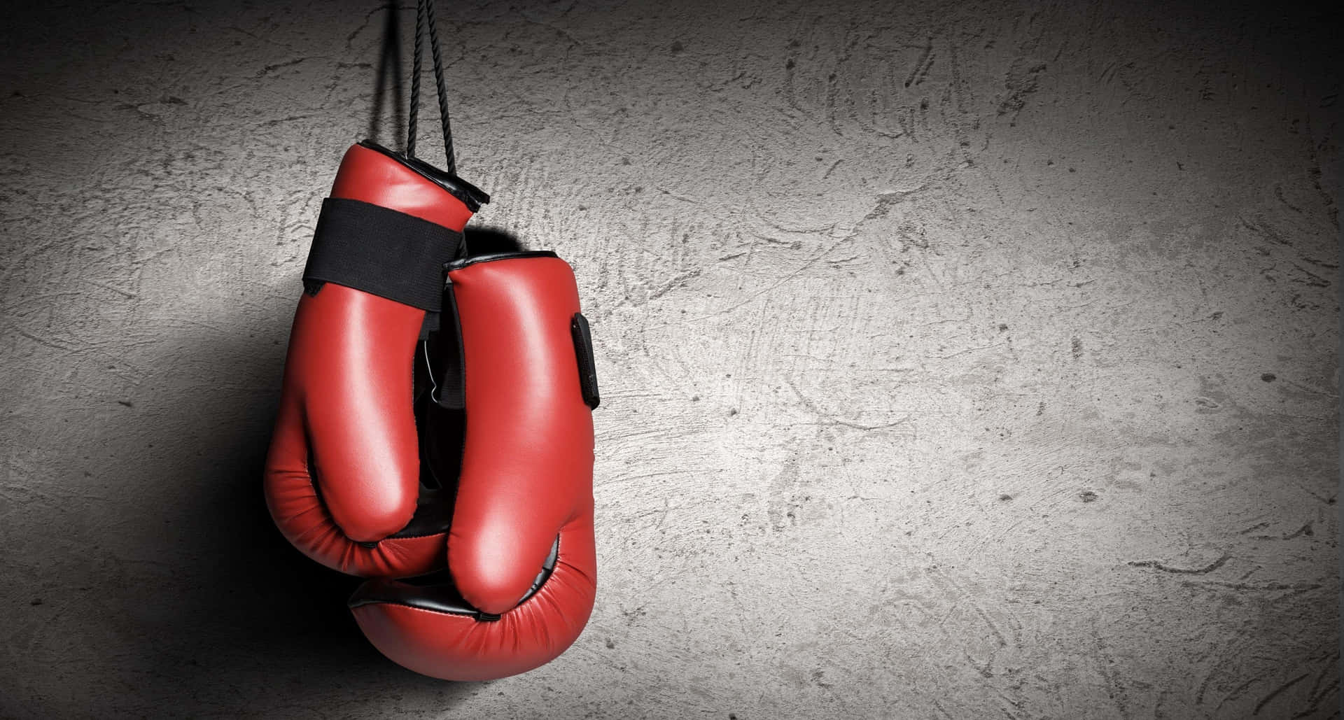 Red Boxing Gloves Hanging Wall Background
