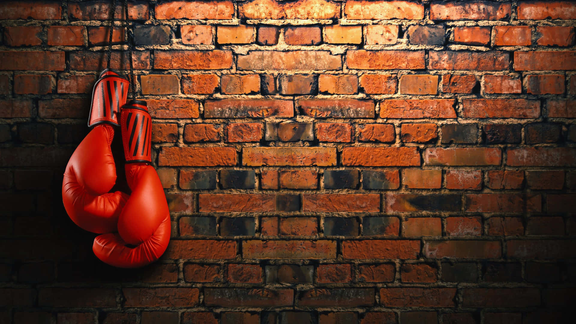 Red Boxing Gloves Hangingon Brick Wall Background