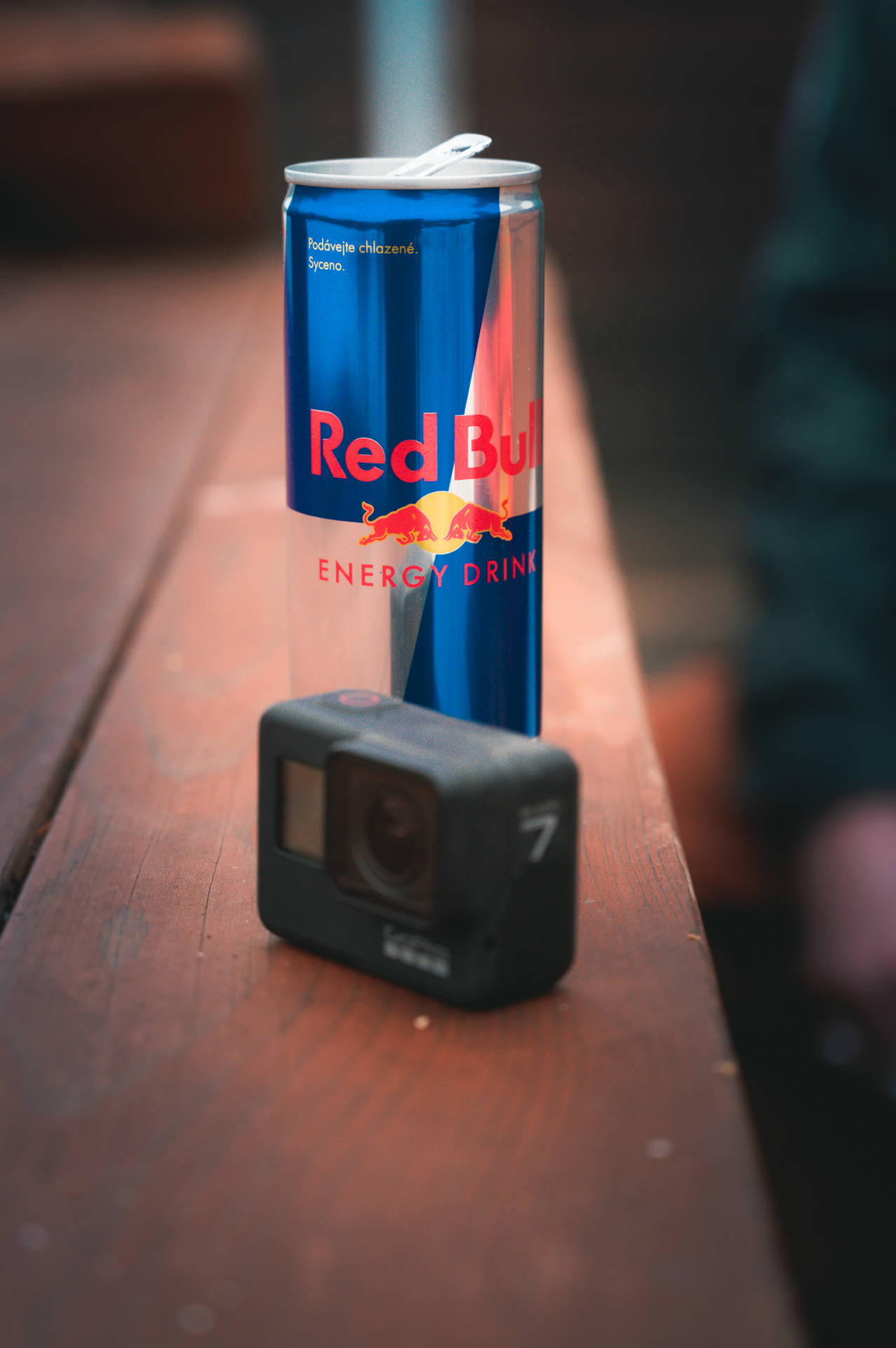 Red Bull And Gopro On Table Background