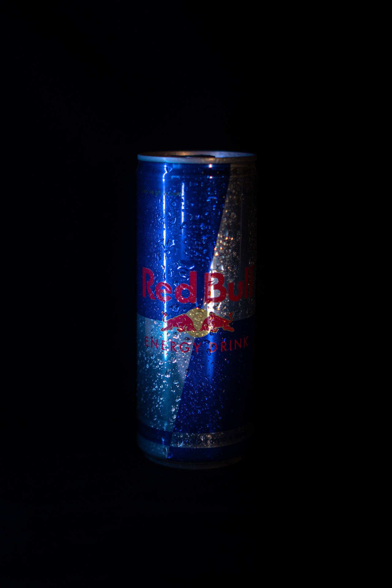 Red Bull Can In Dark Background