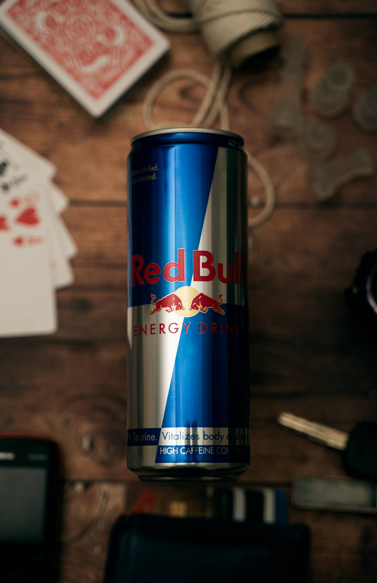 Red Bull Can With Cards Table Background