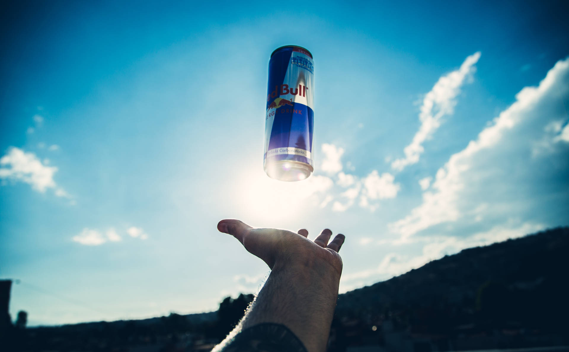 Red Bull Floating Above Hand