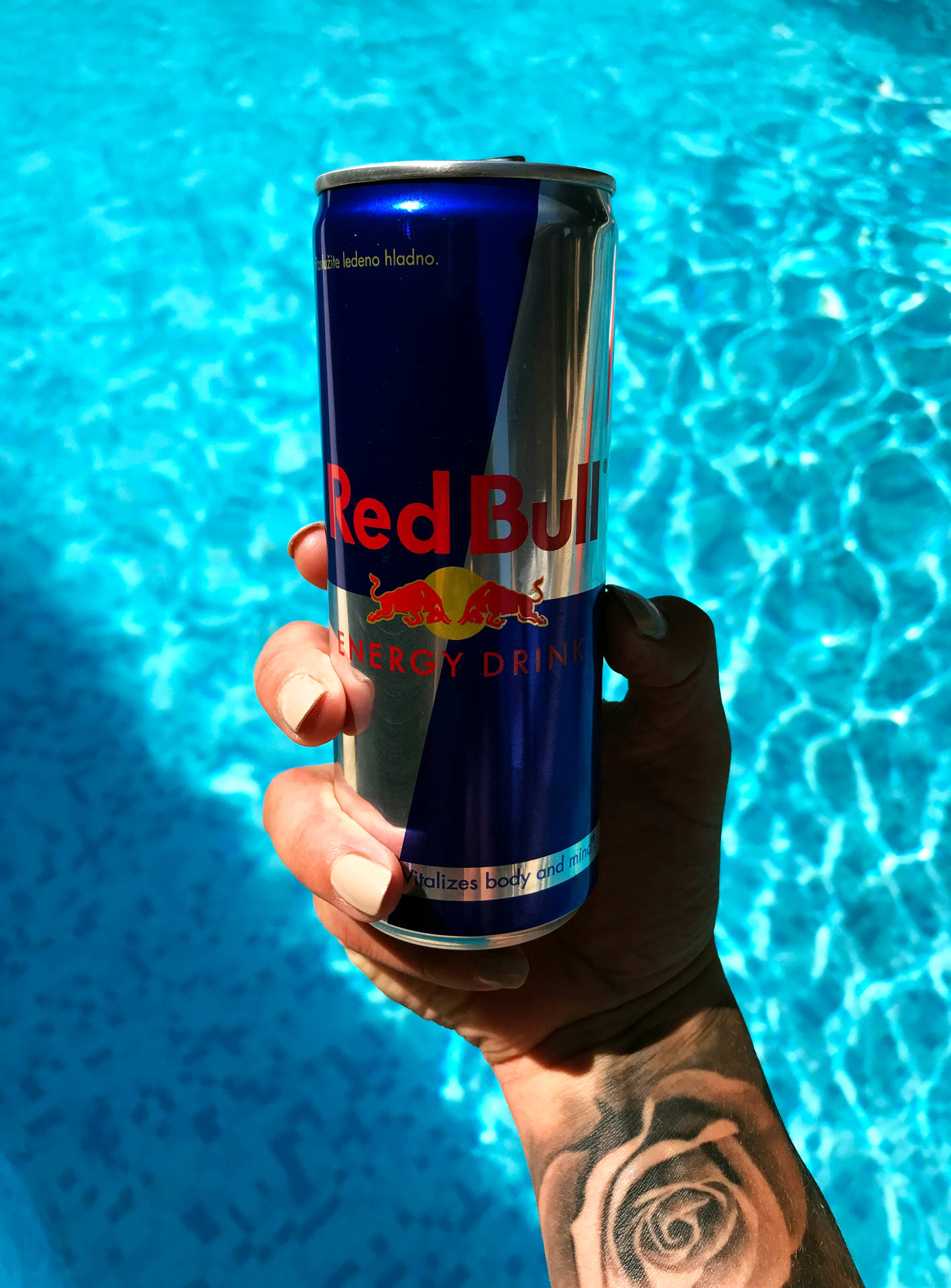 Red Bull Hand On Water Background