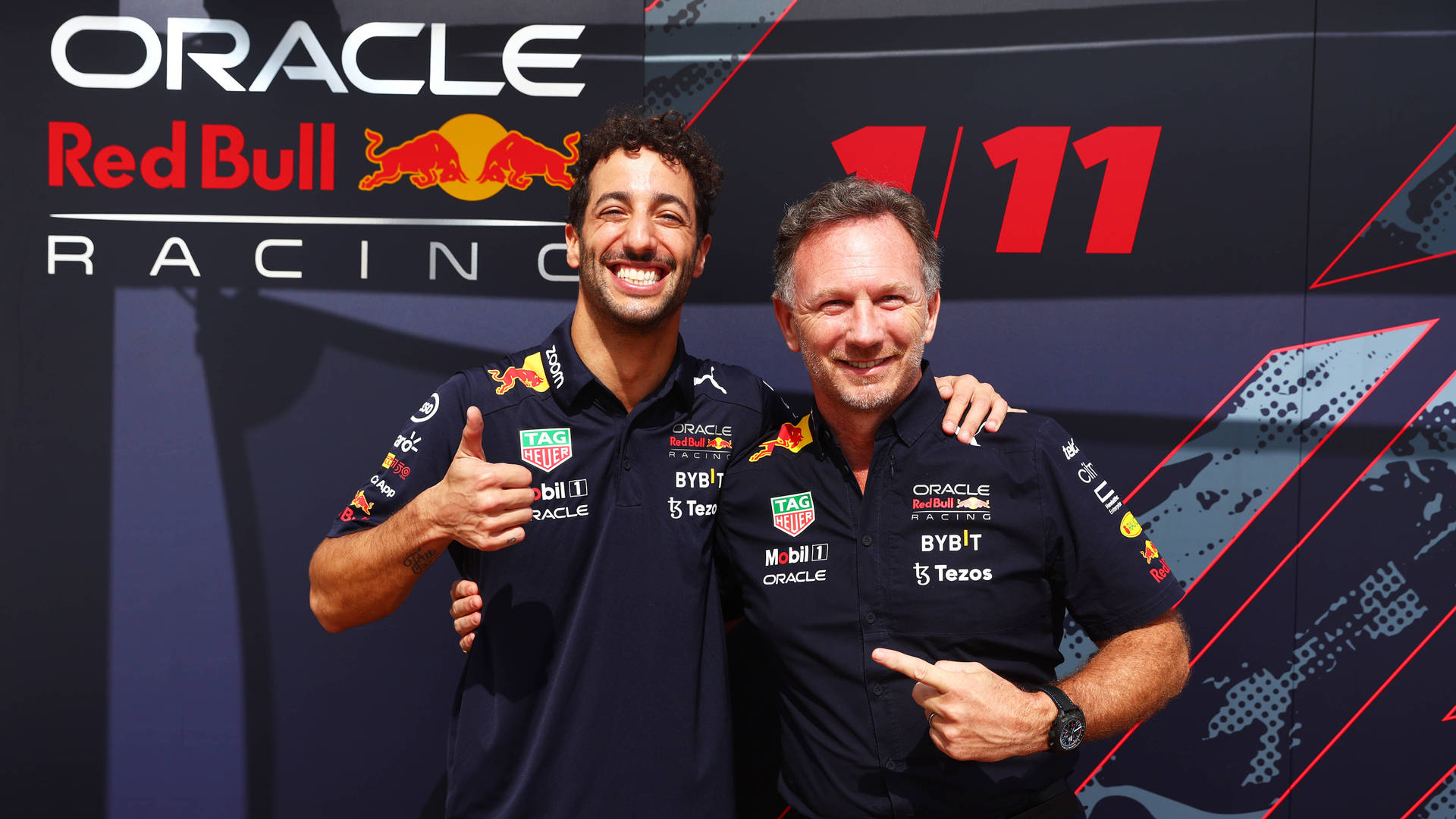 Red Bull Racing - Daniel Ricciardo Flash A Winning Smile Background