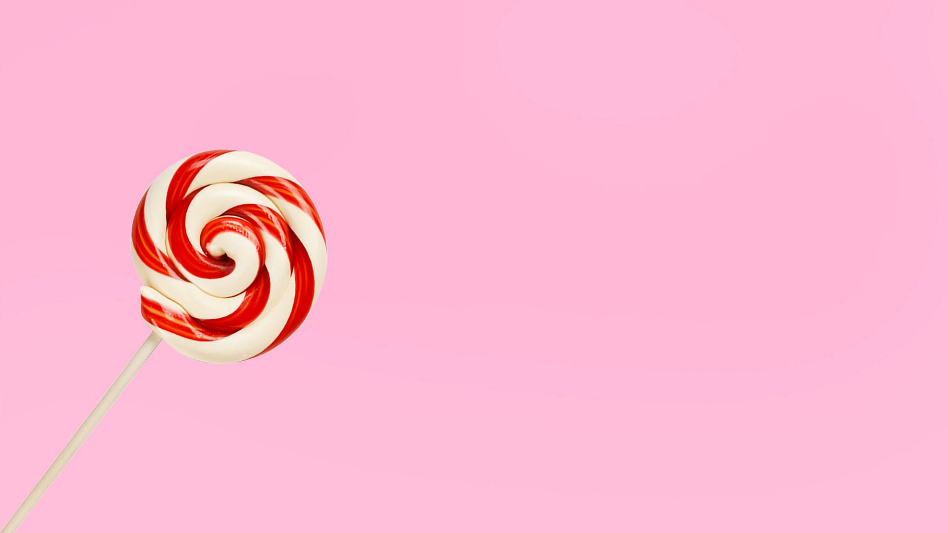 Red Candy On Pastel Pink Background