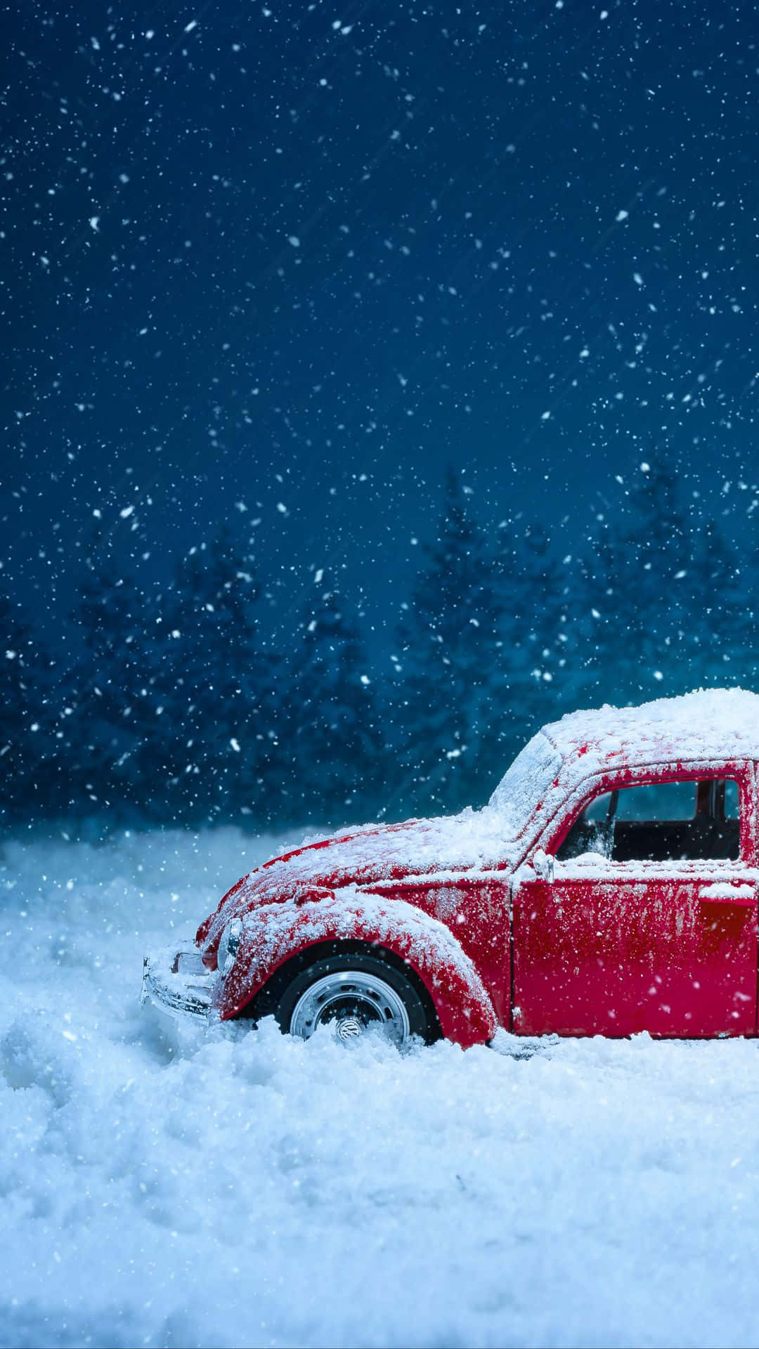 Red Car With Snow Falling