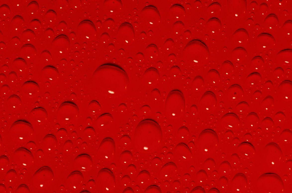 Red Color Surface With Drops