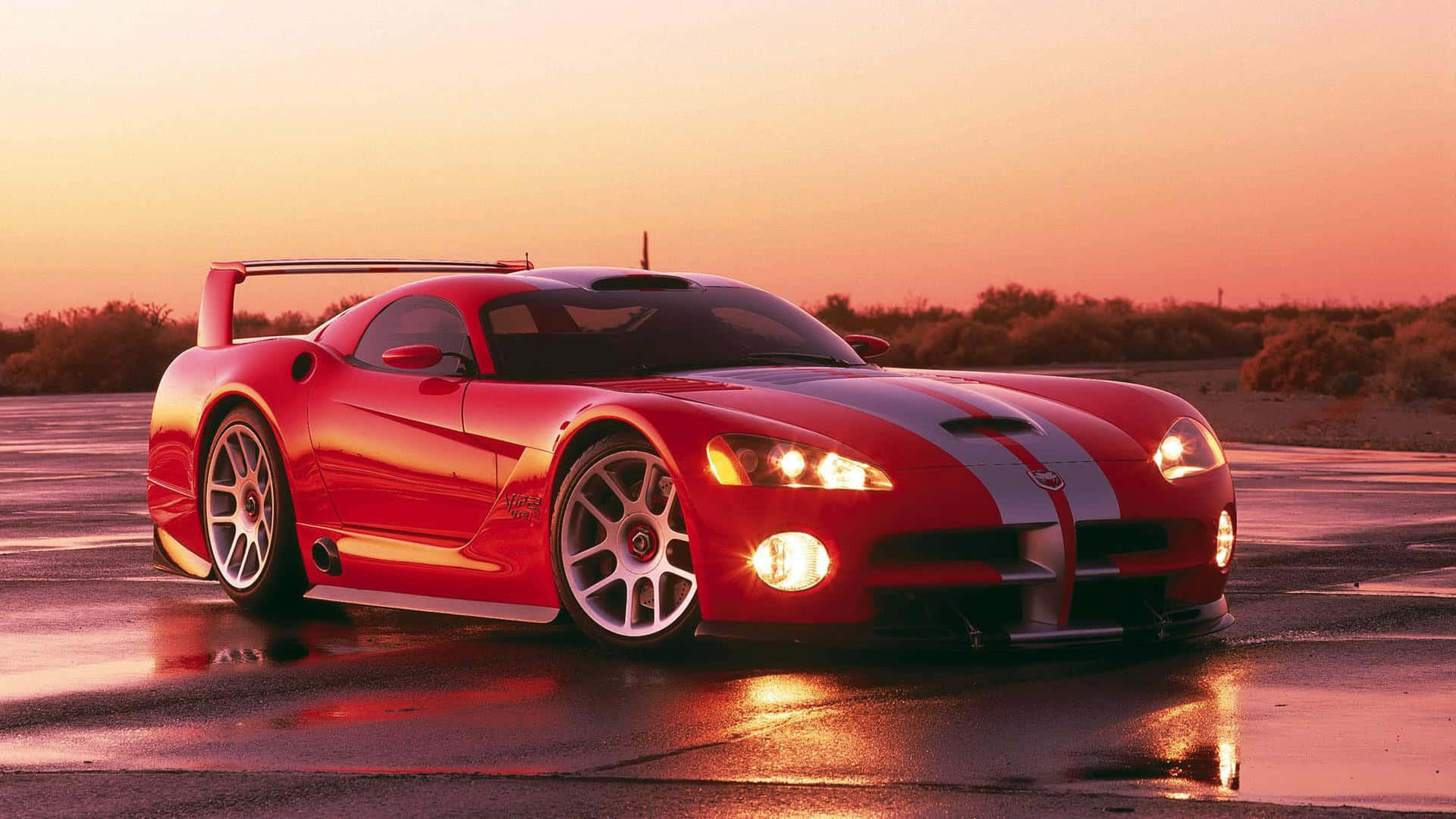 Red Dodge Viper Headlights Turned On Background