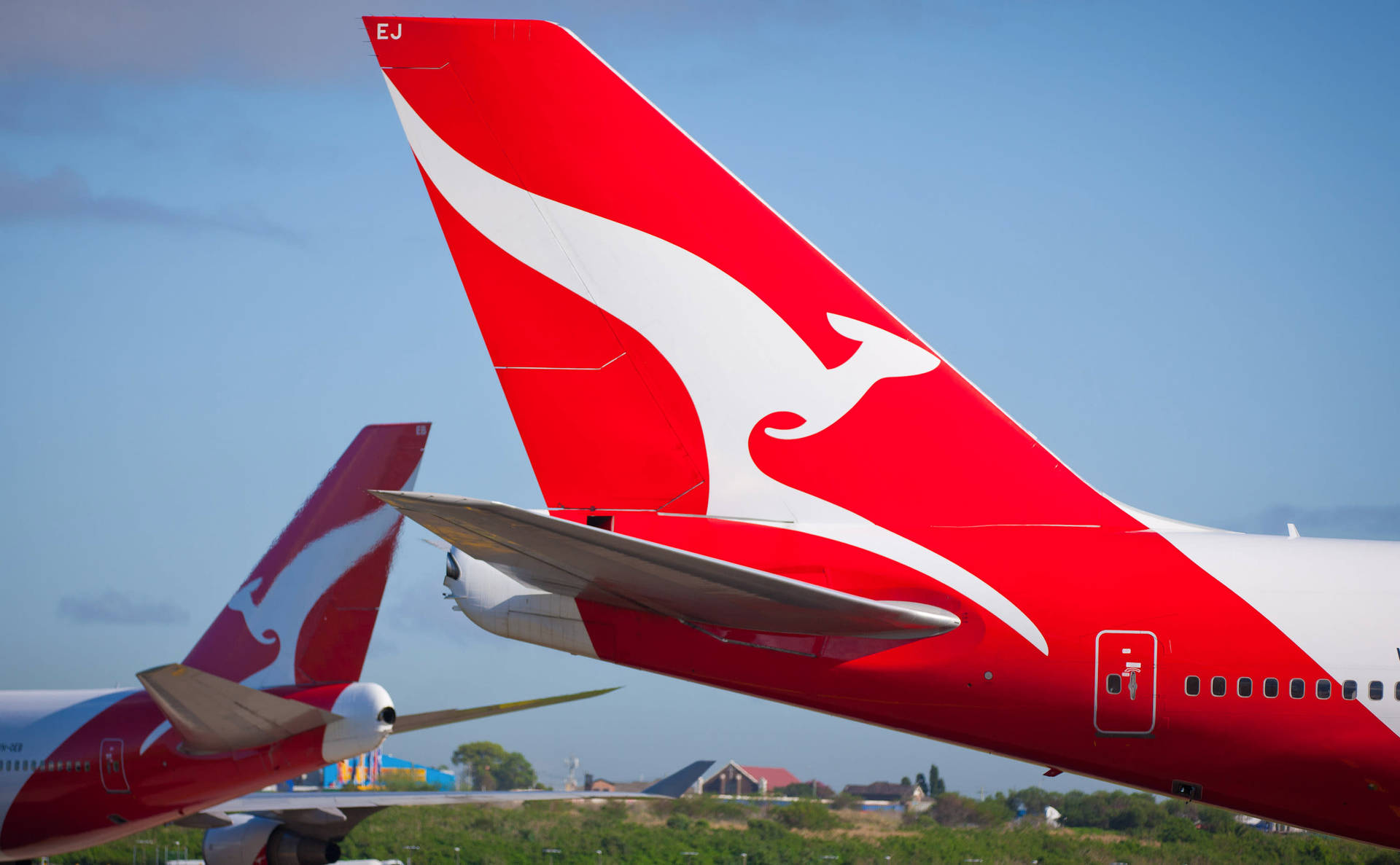 Red Empennage Of Qantas Airways Background