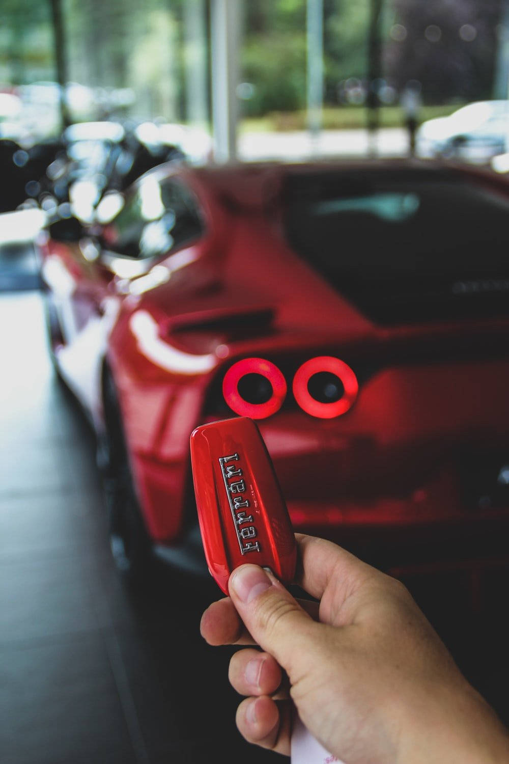 Red Ferrari Luxury Car Key Background