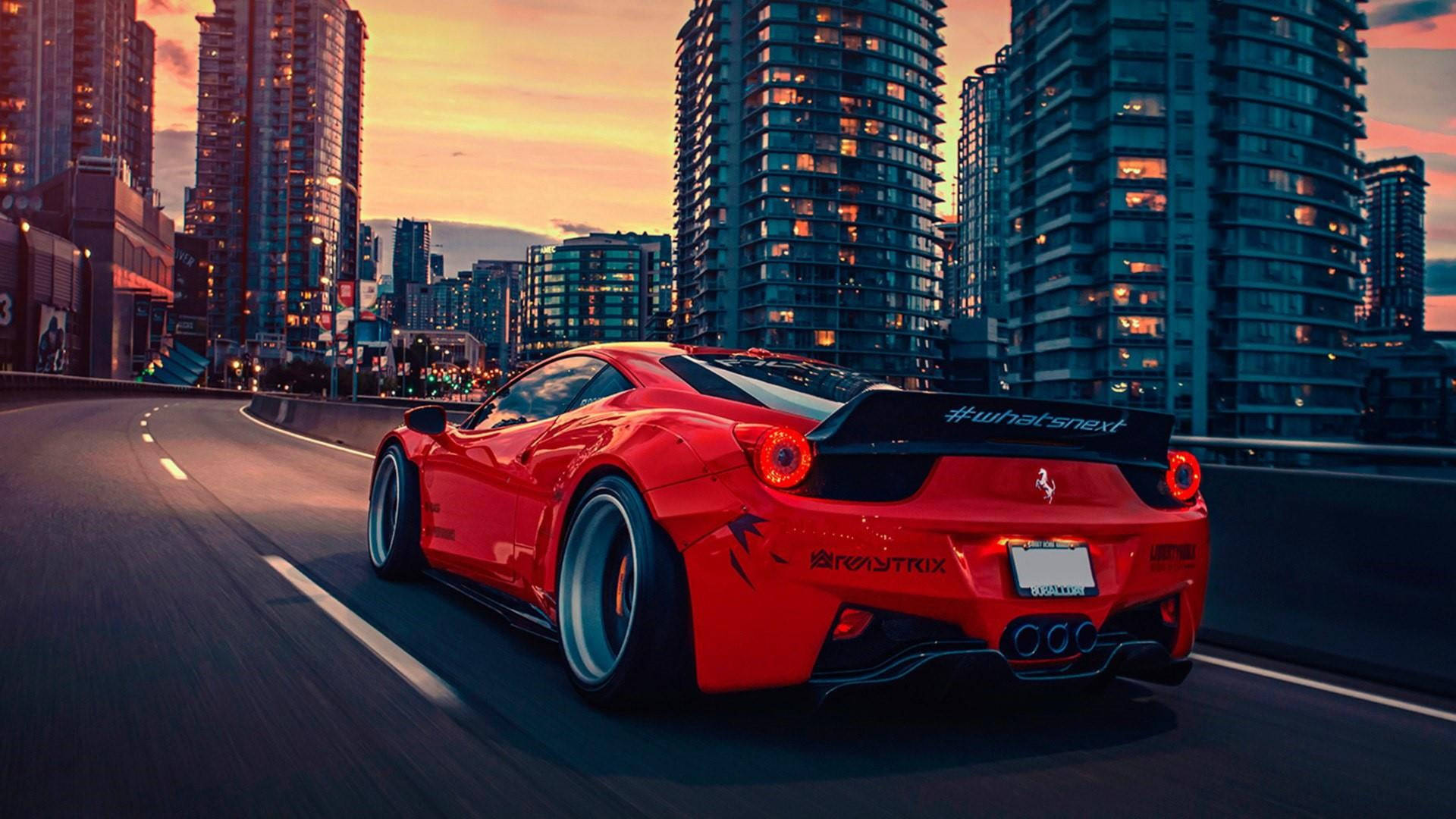 Red Ferrari Racing Car In City Background