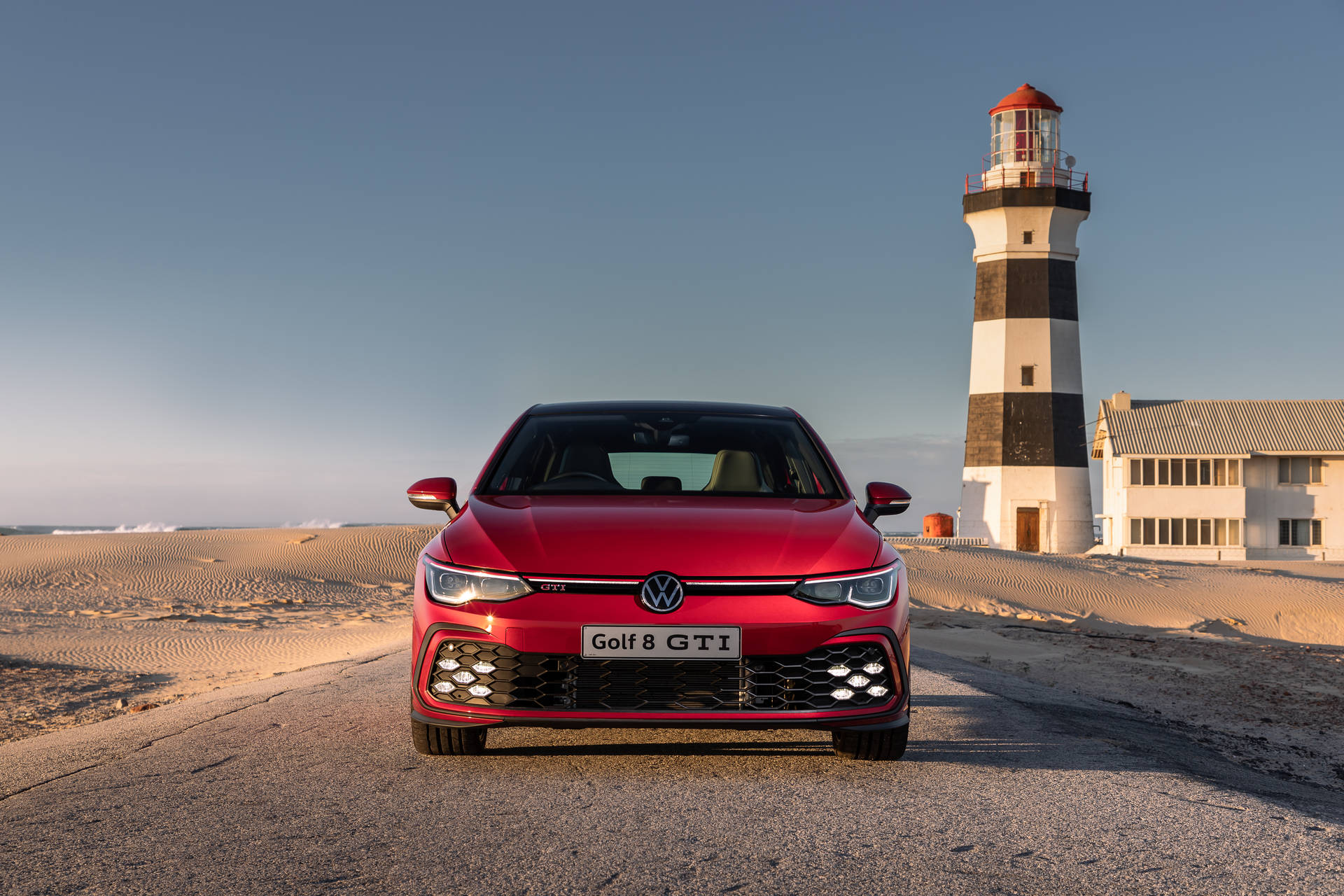 Red Golf Gti Mk8 On Beach Background