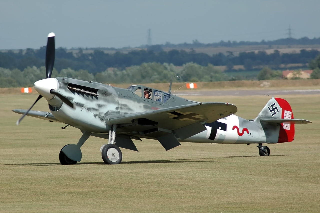 Red, Gray, And White German Ww2 Fighters Background