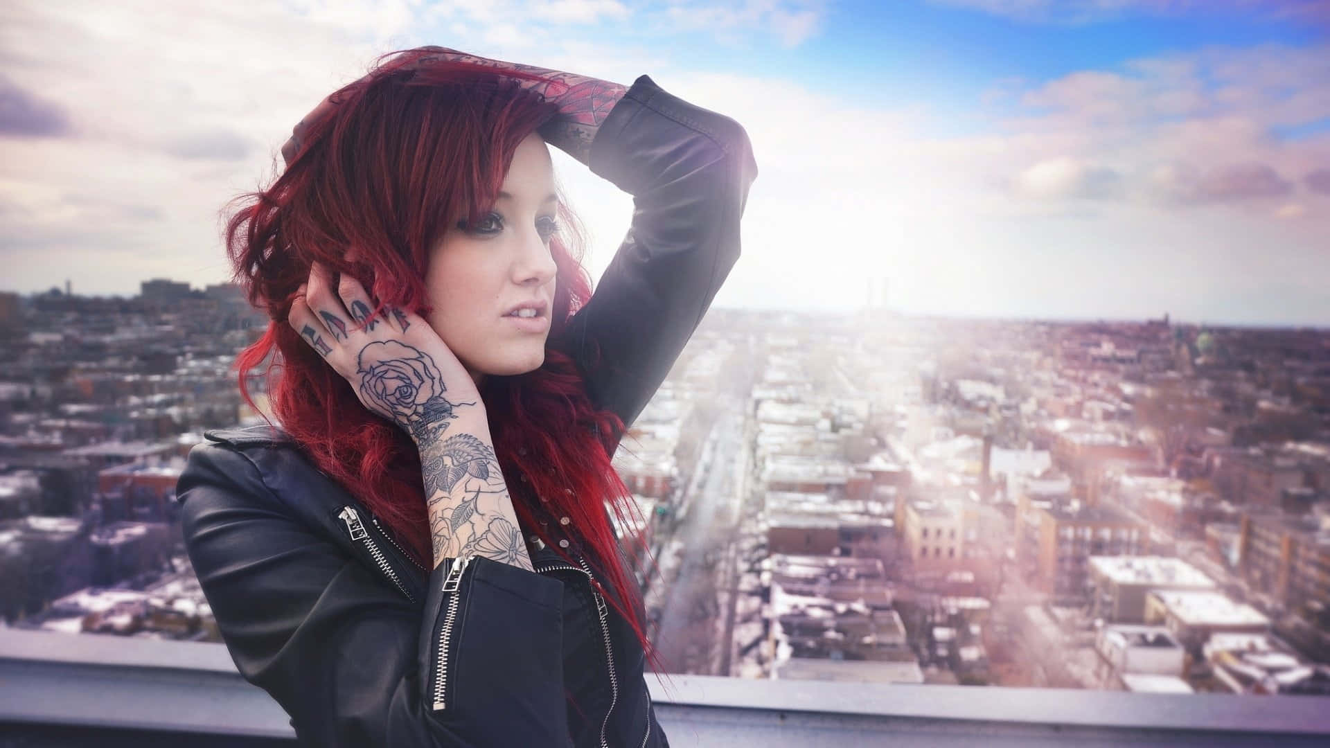 Red-haired Lady Showcasing Her Hand Tattoo Background