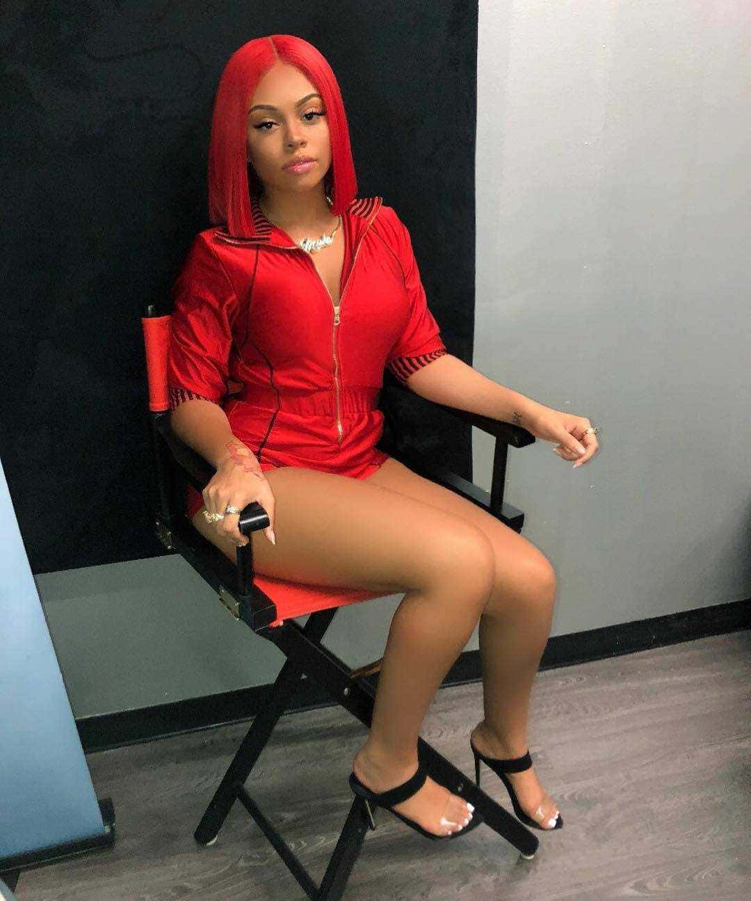 Red Haired Womanin Red Hoodieand Heels Background