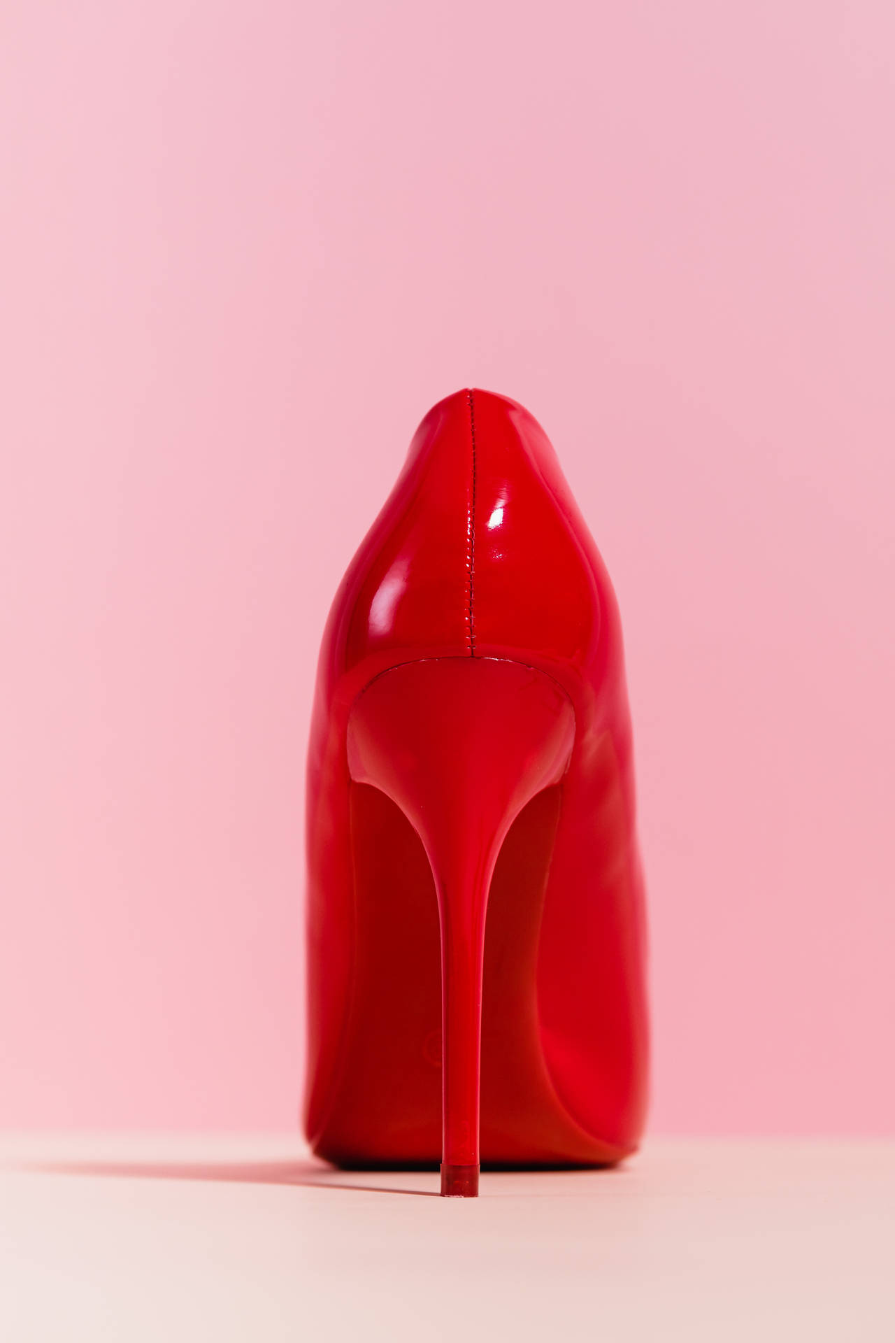 Red Heels On Pink Background Background