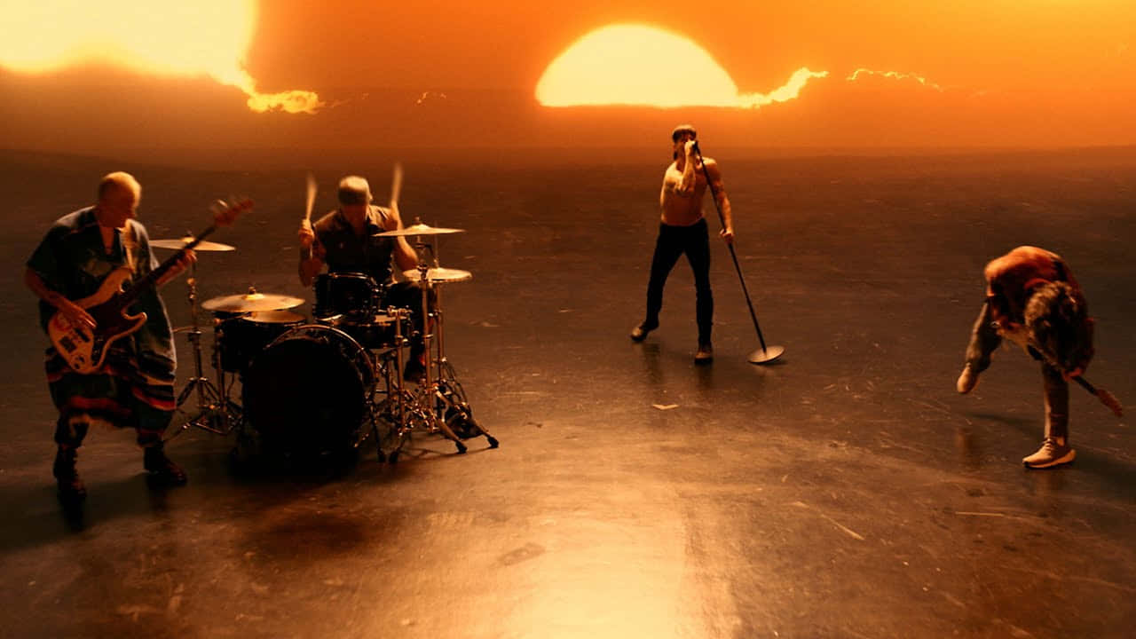 Red Hot Chili Peppers Playing Music During Sunset