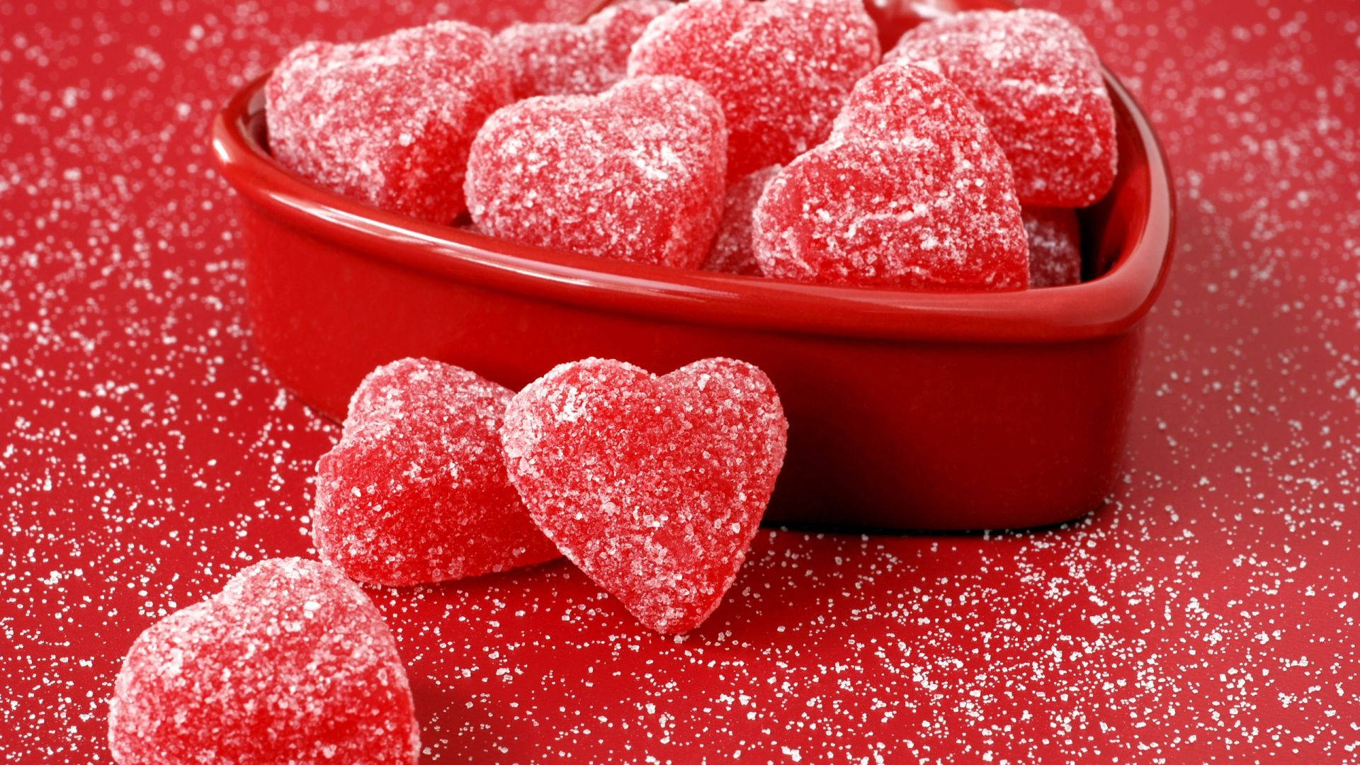 Red Jelly Hearts Sprinkled With Sugar Background