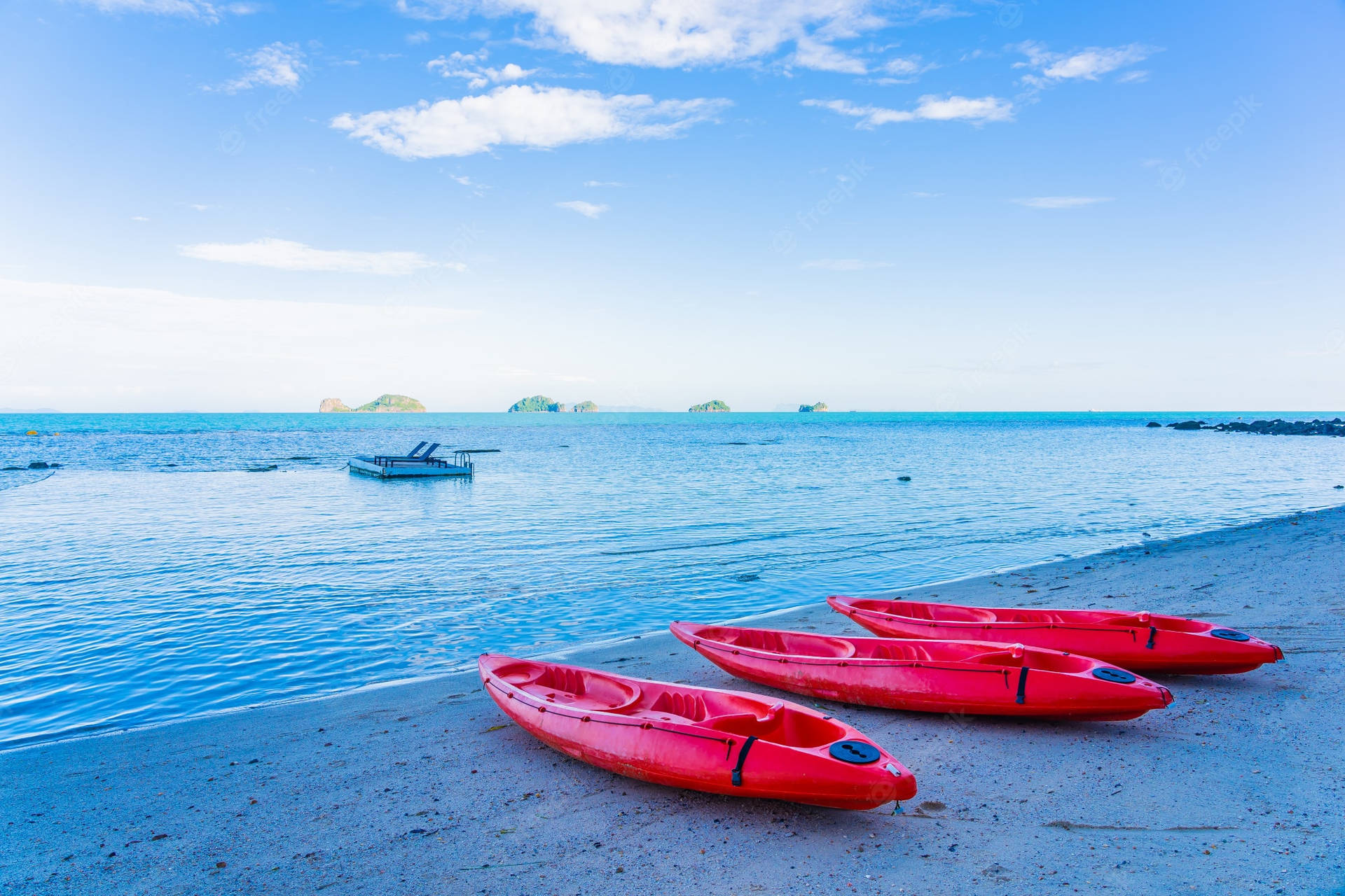 Red Kayaks By The Beach