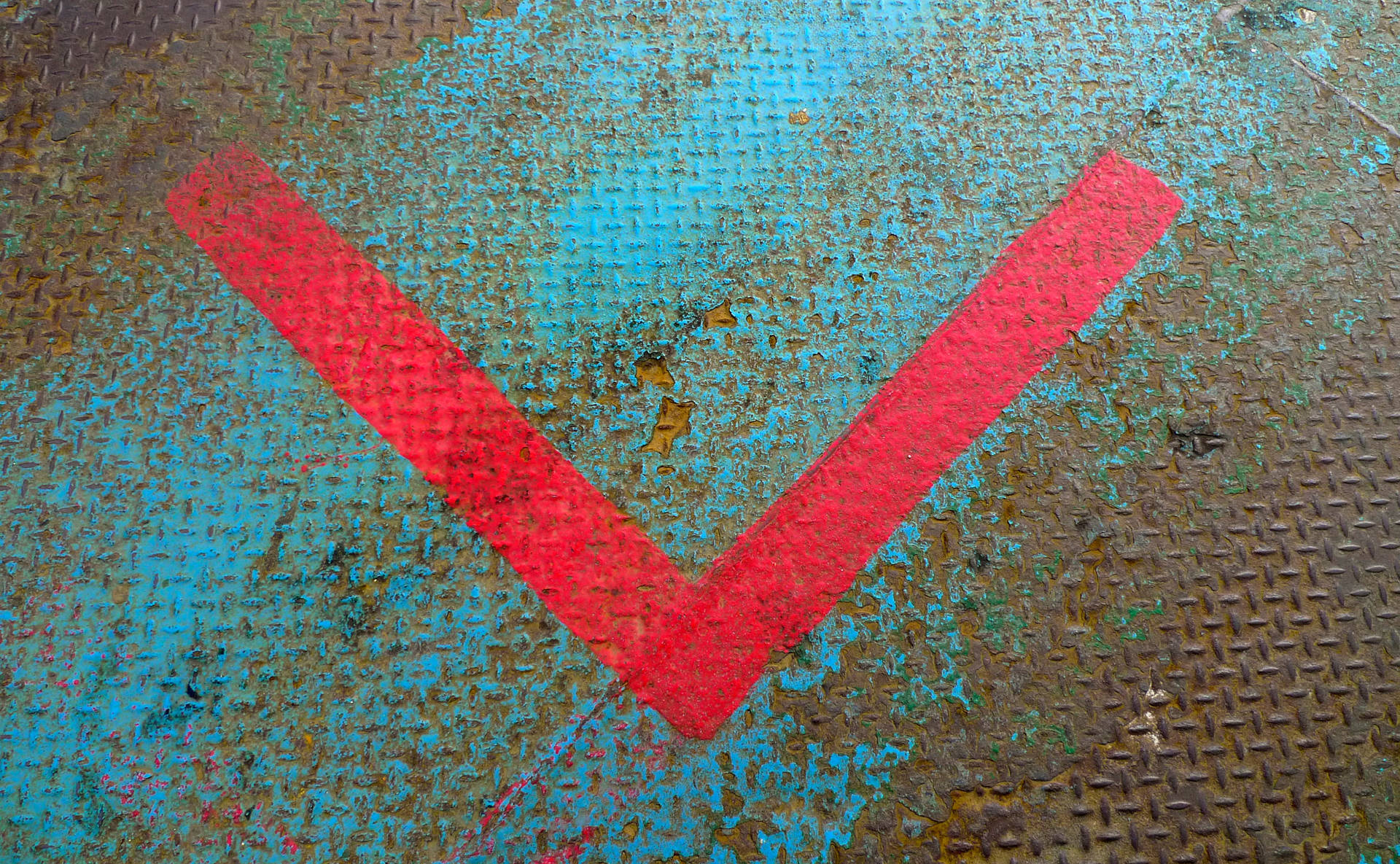 Red Letter V On Rusty Floor Background