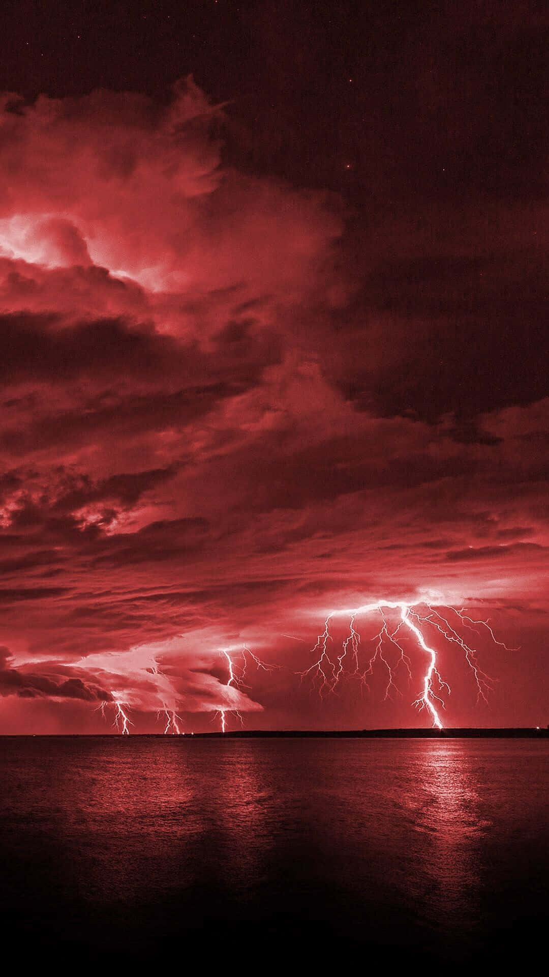 Red Lightning Over Ocean View Background