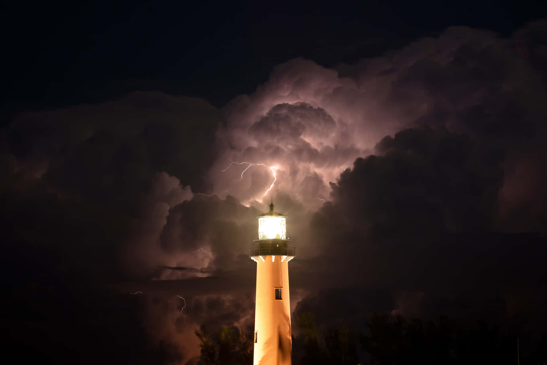 Red Lightning Strike At Lighthouse Background