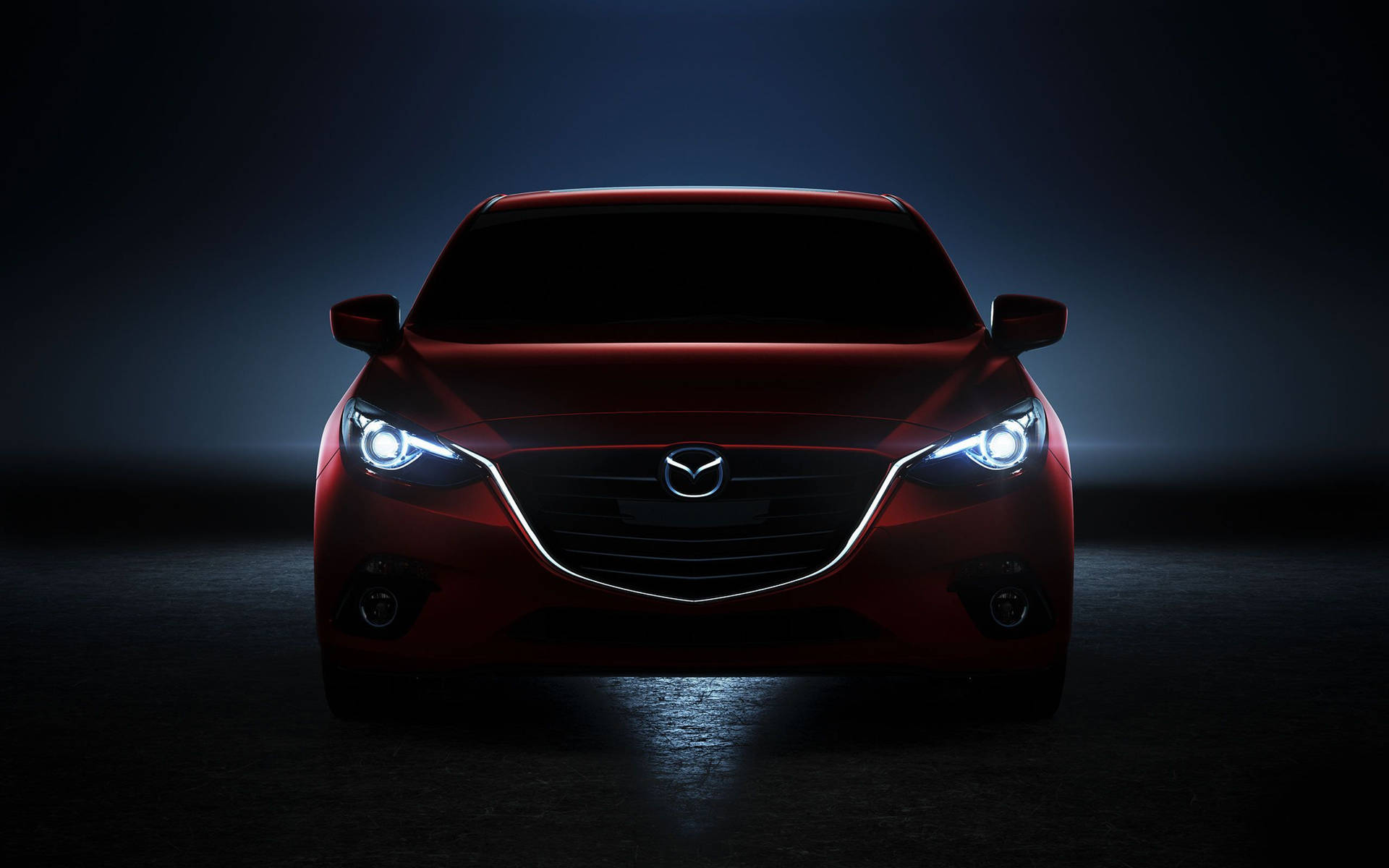 Red Mazda 2 In Darkness Background