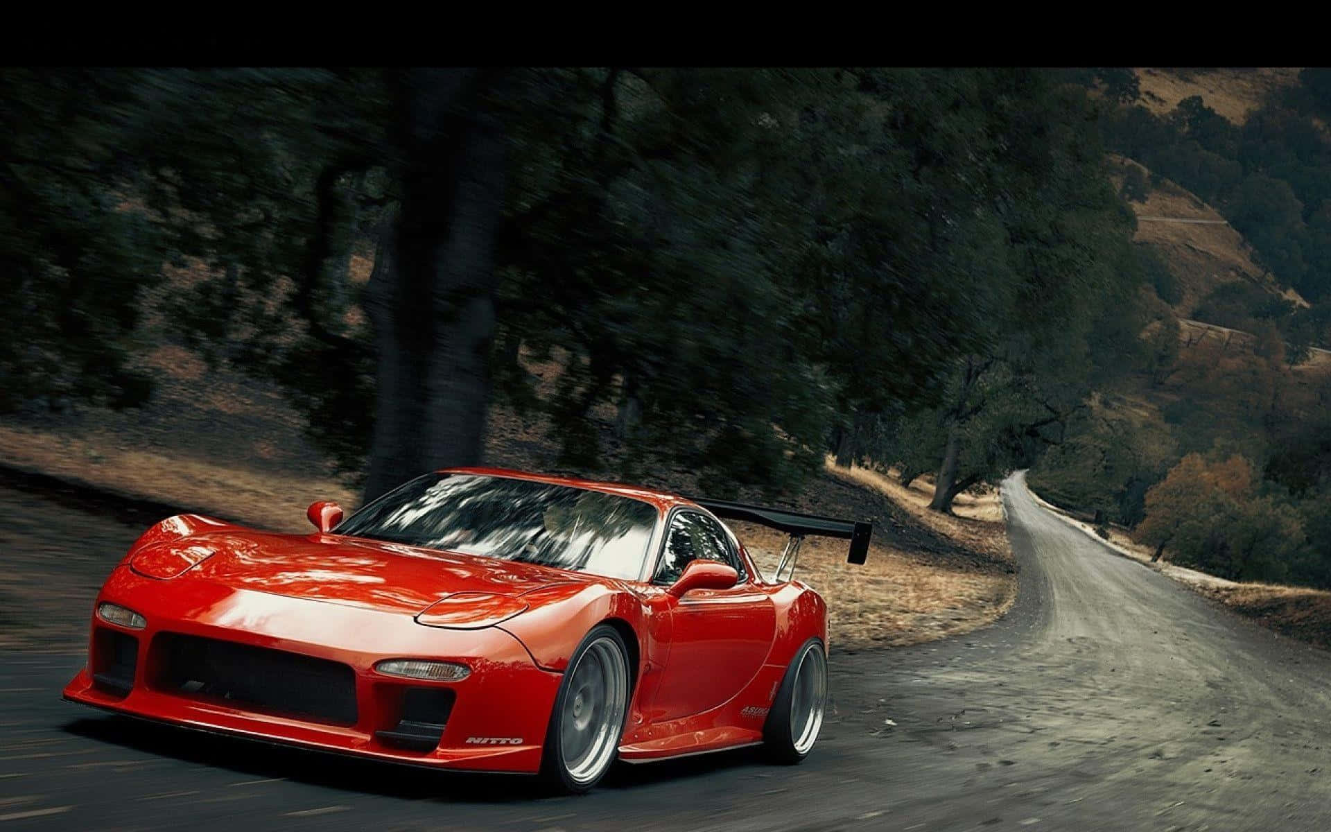 Red Mazda Rx 7 Driving Uphill Background