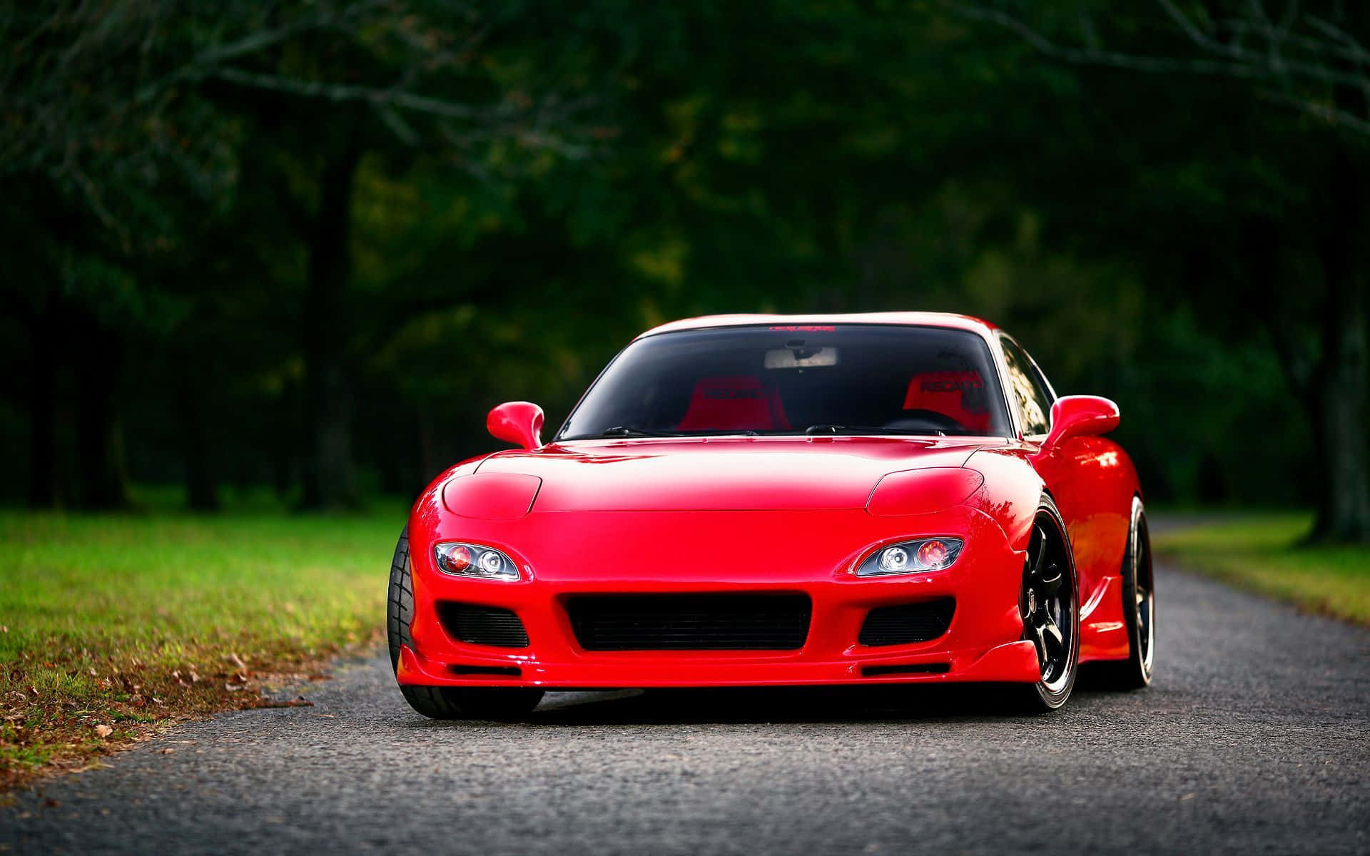 Red Mazda Rx 7 In Woods Background