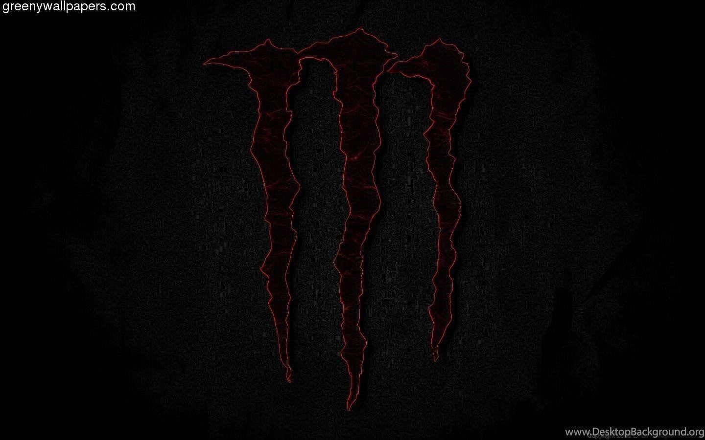 Red Monster Logo Illuminated On Dark Screen