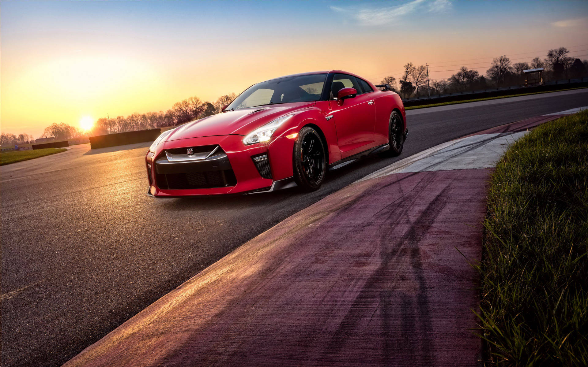 Red Nissan Gtr Car During Sundown