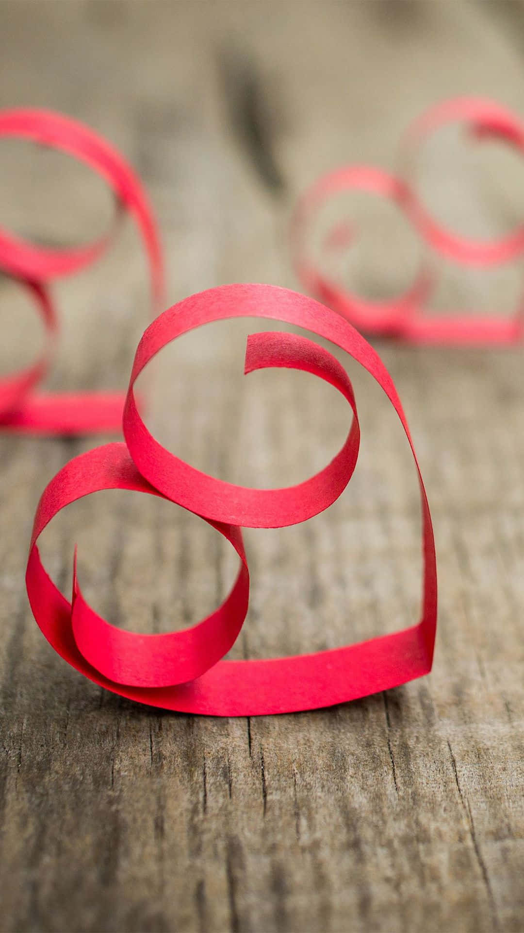 Red Paper Heart Shaped On A Wooden Table Background