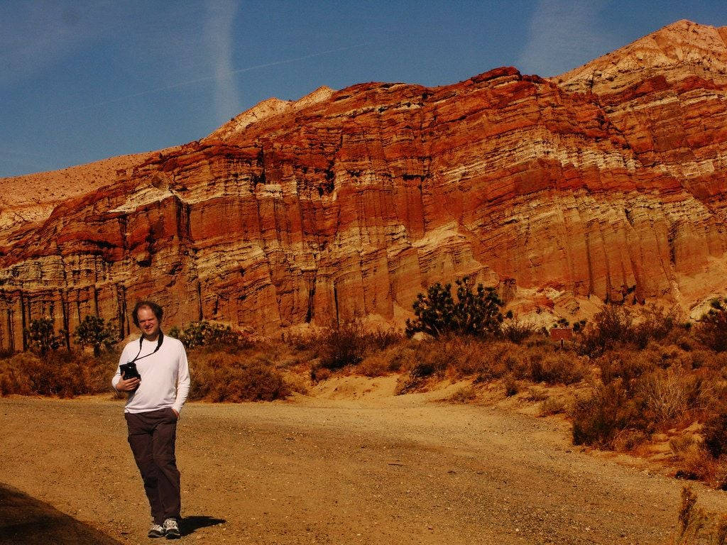 Red Rock Formation And Tourist Background