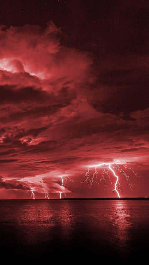 Red Sky Lightning Over Water Background