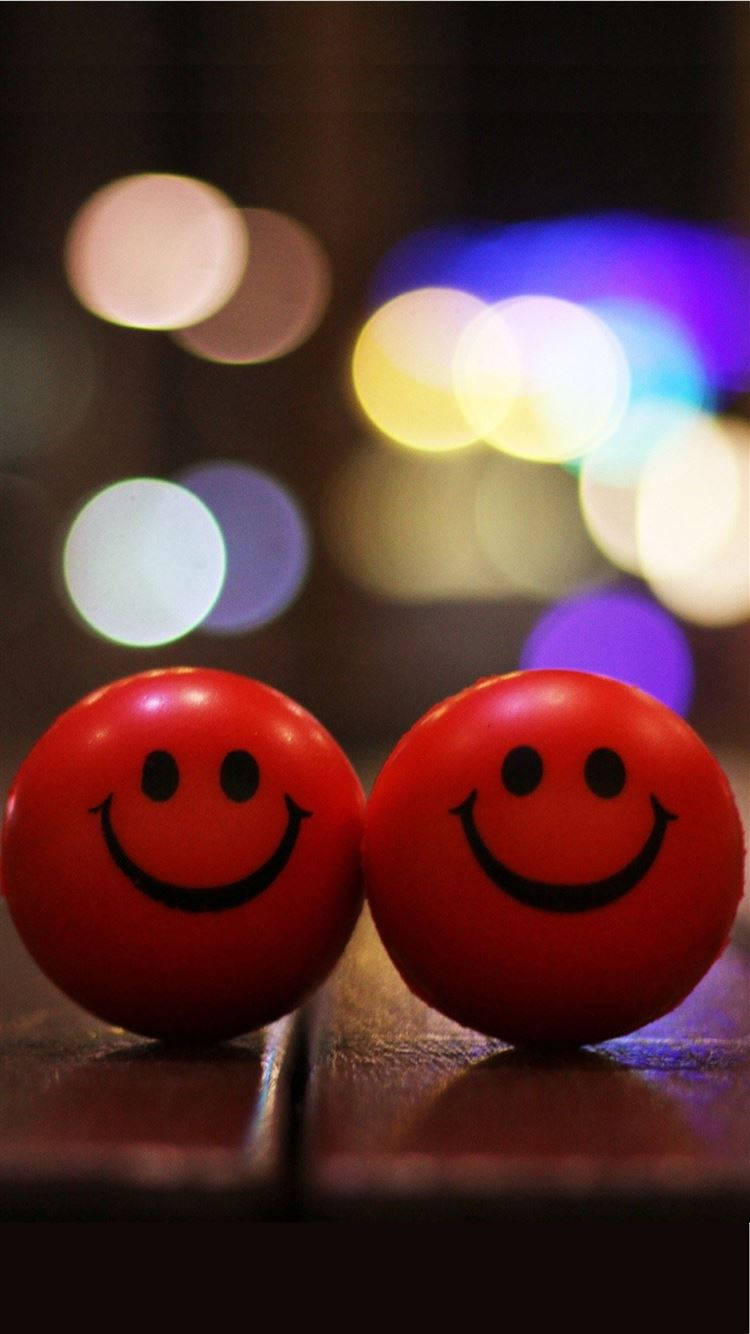 Red Smiley Face Balls Background