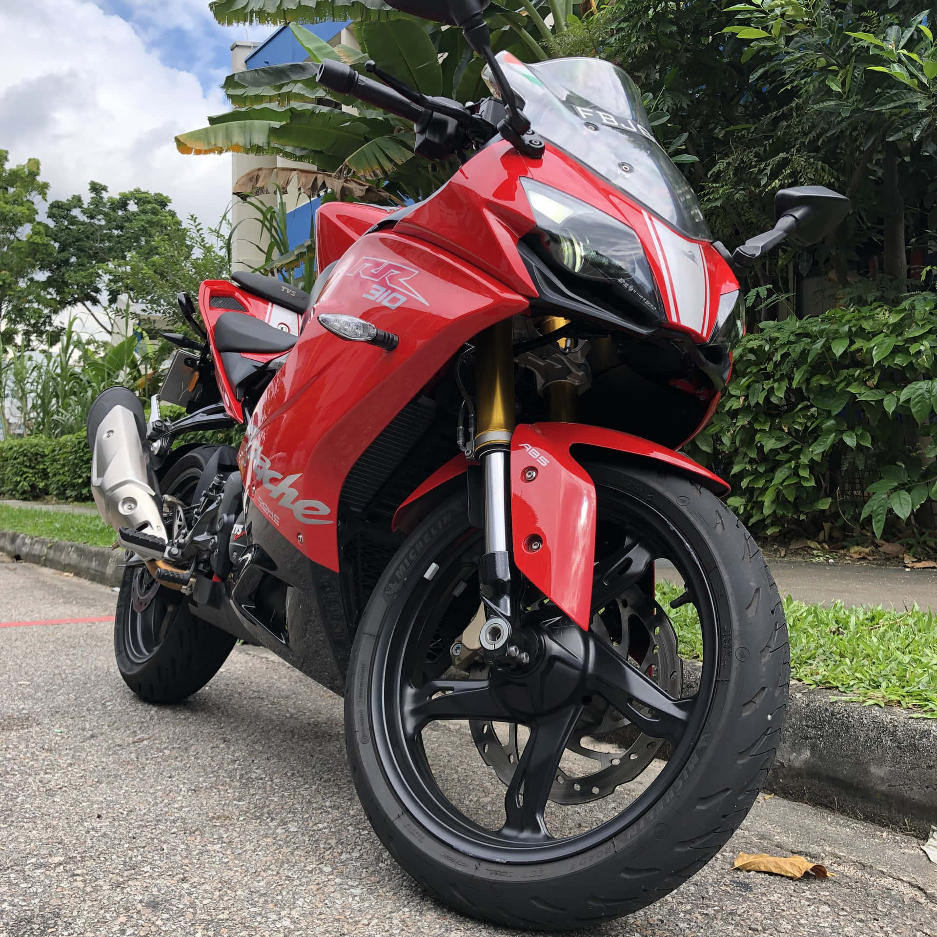 Red Sport Motorcycle Parked Outdoors Background