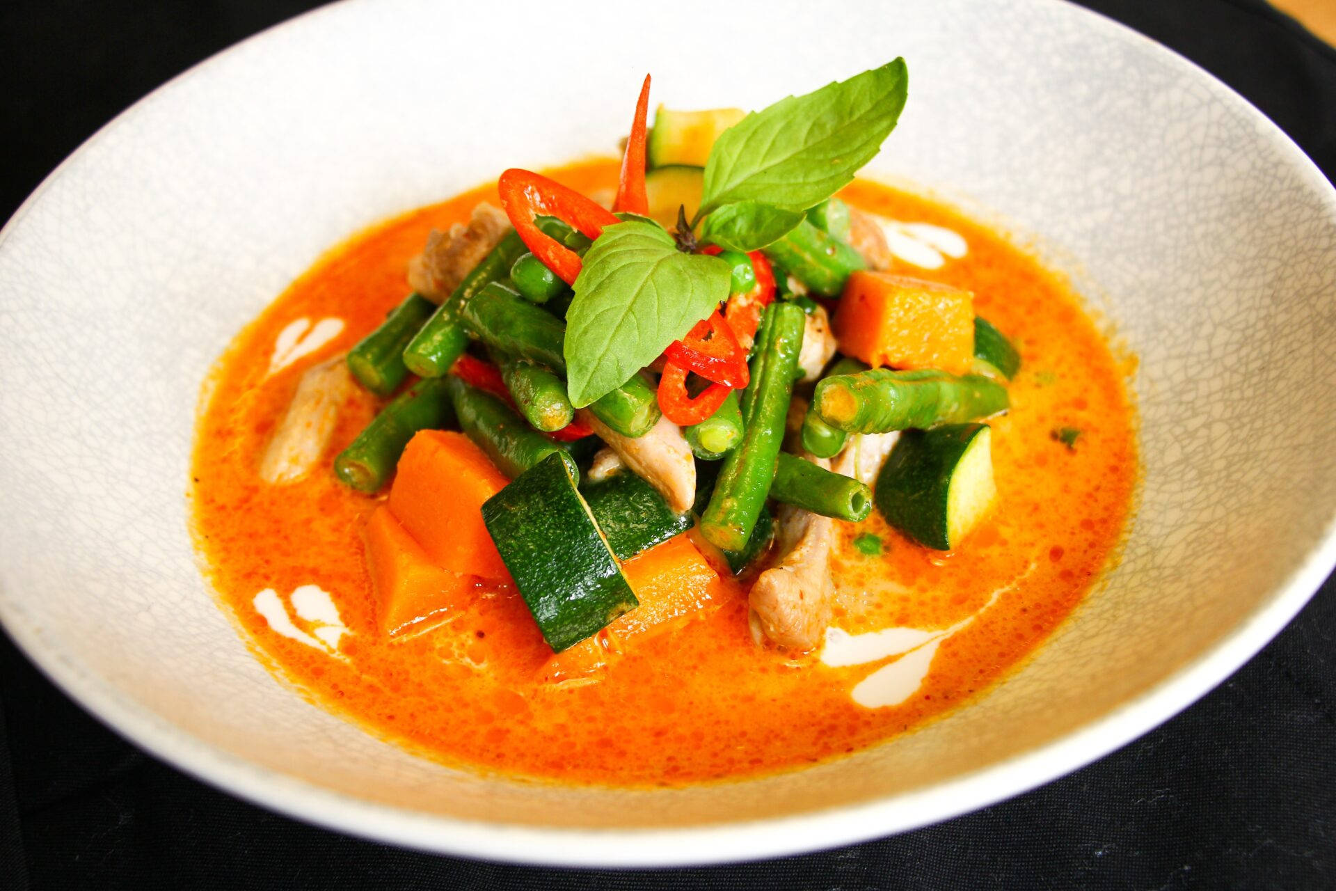 Red Thai Curry With Artistic Plating Background