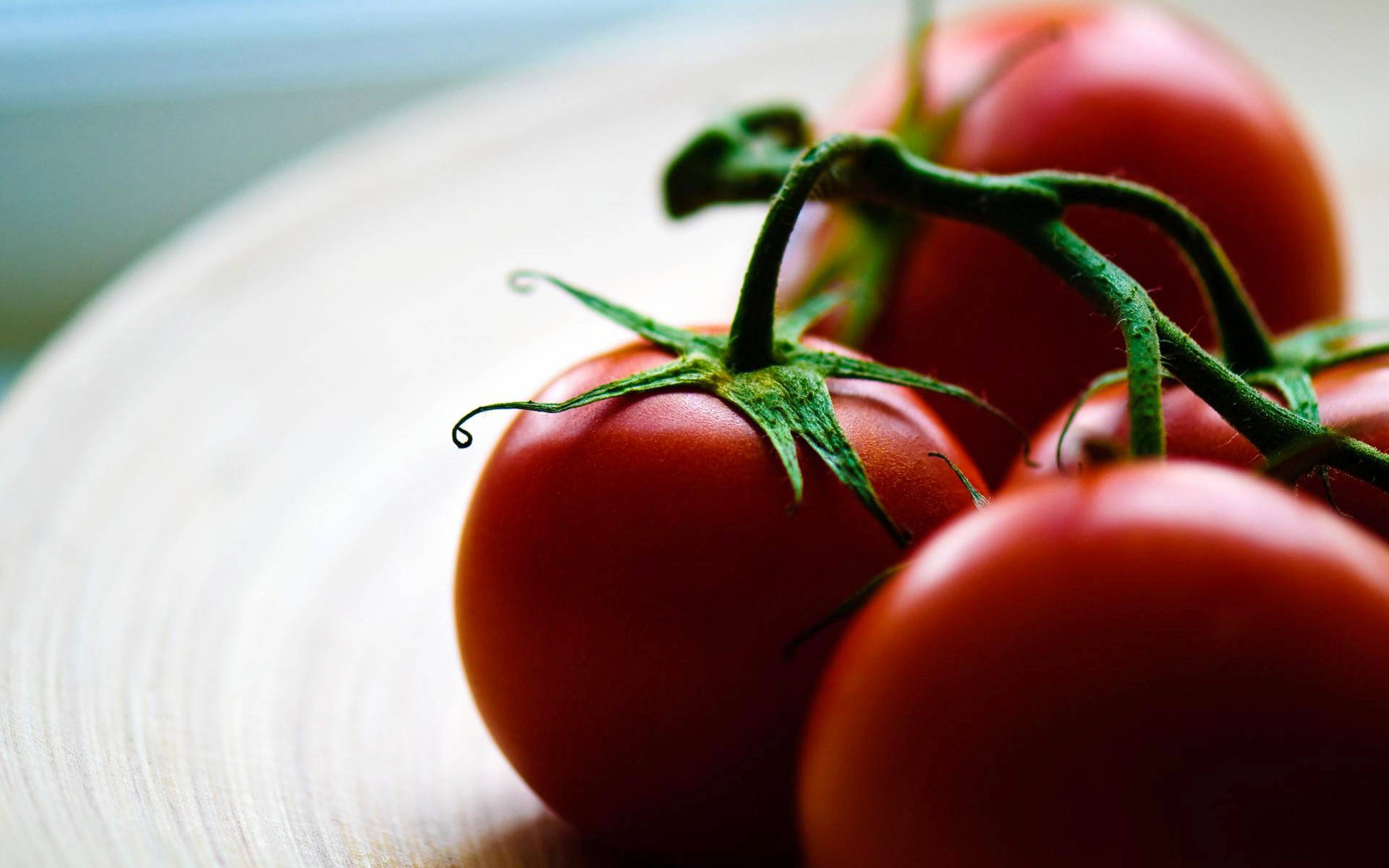 Red Tomato Fruits On Table Background