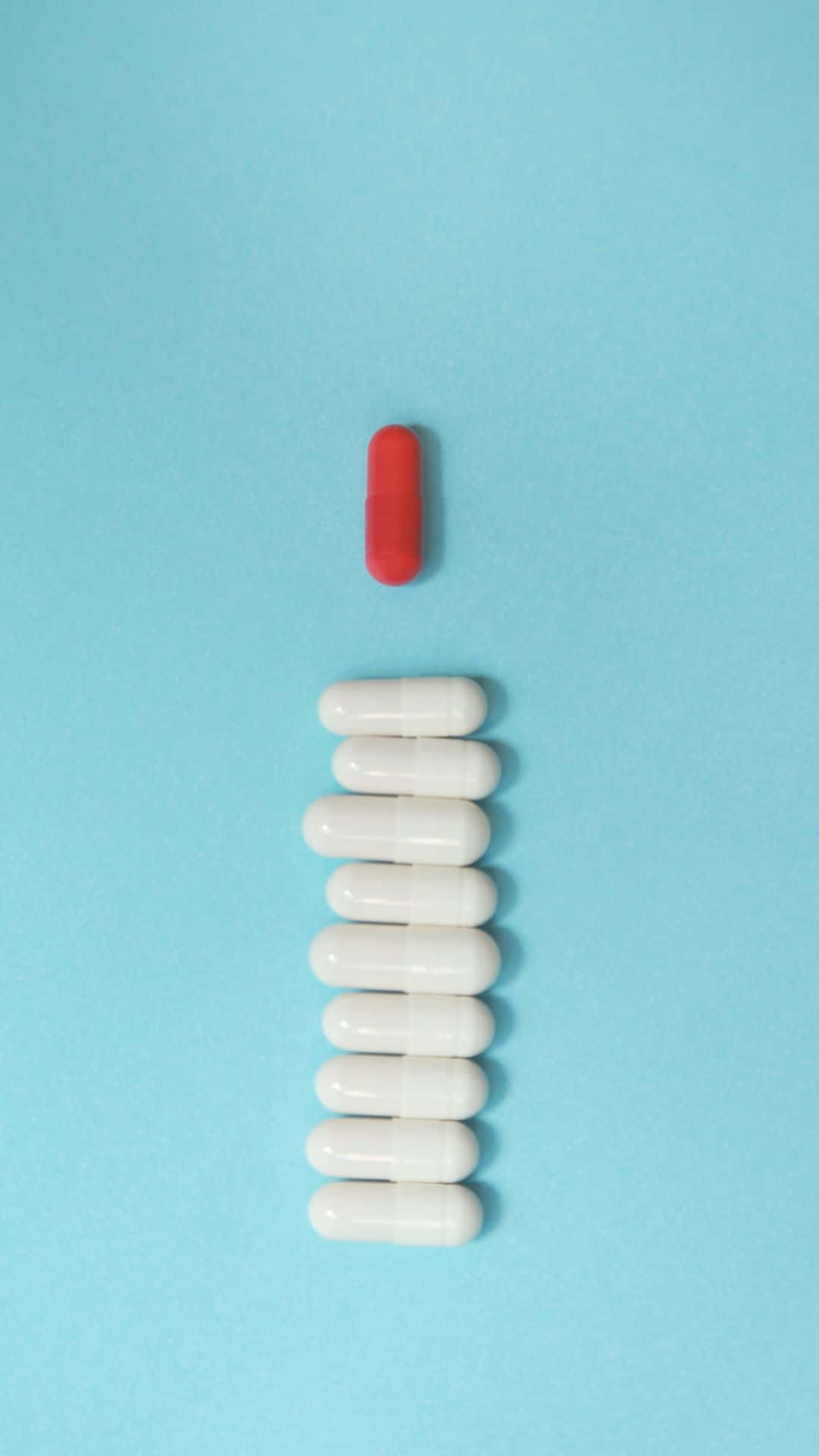 Redand White Capsulewith White Pills Background