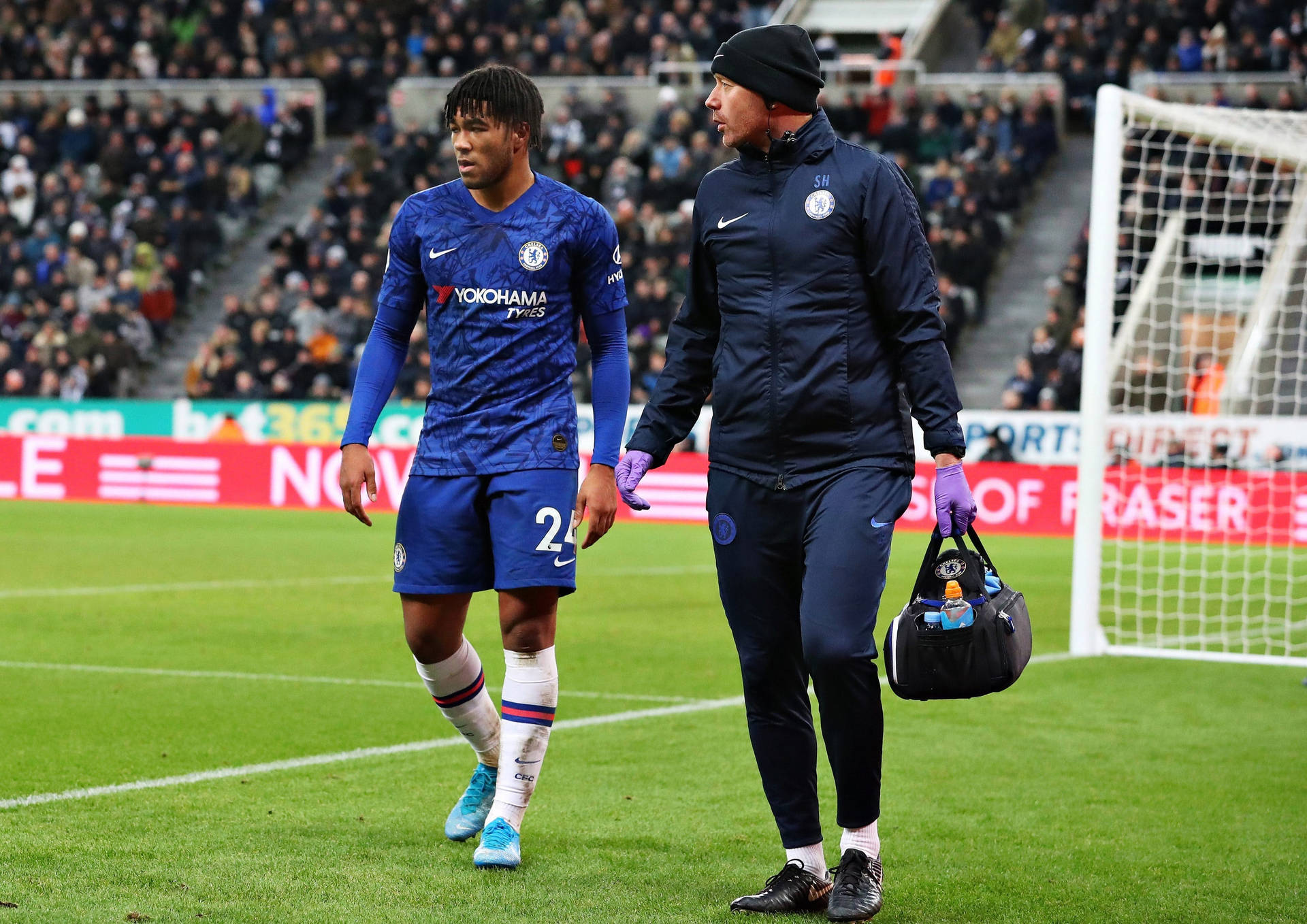 Reece James Walking Alongside Staff Background