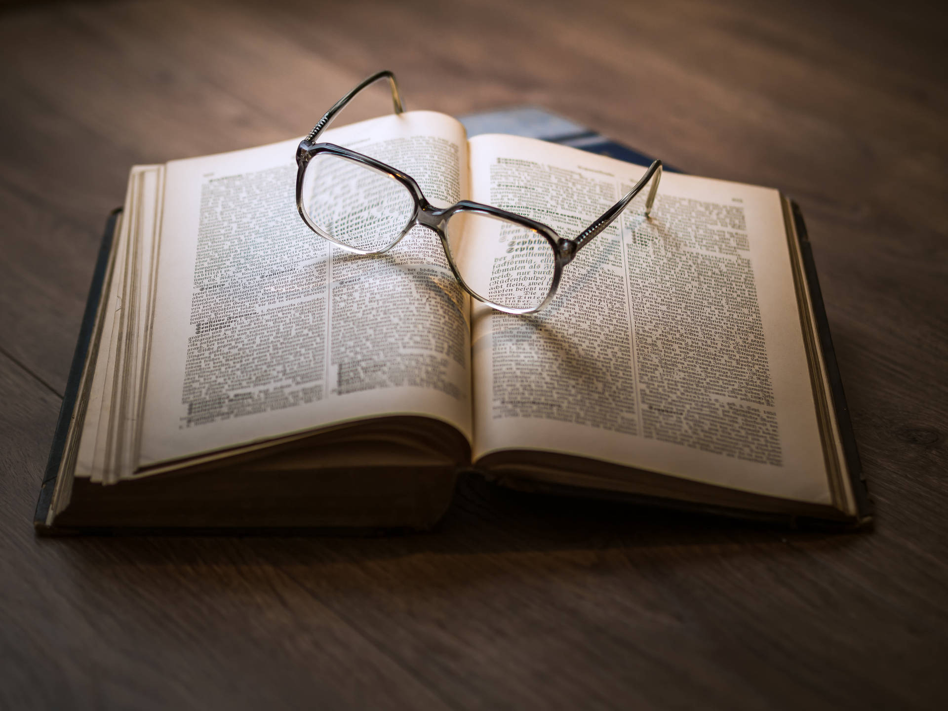 Reference Book With Eyeglasses Background