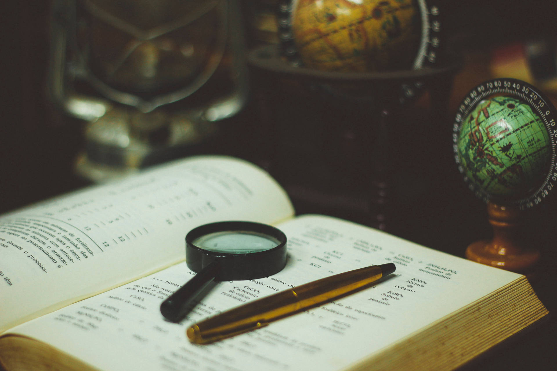 Reference Book With Magnifying Glass And Pen Background