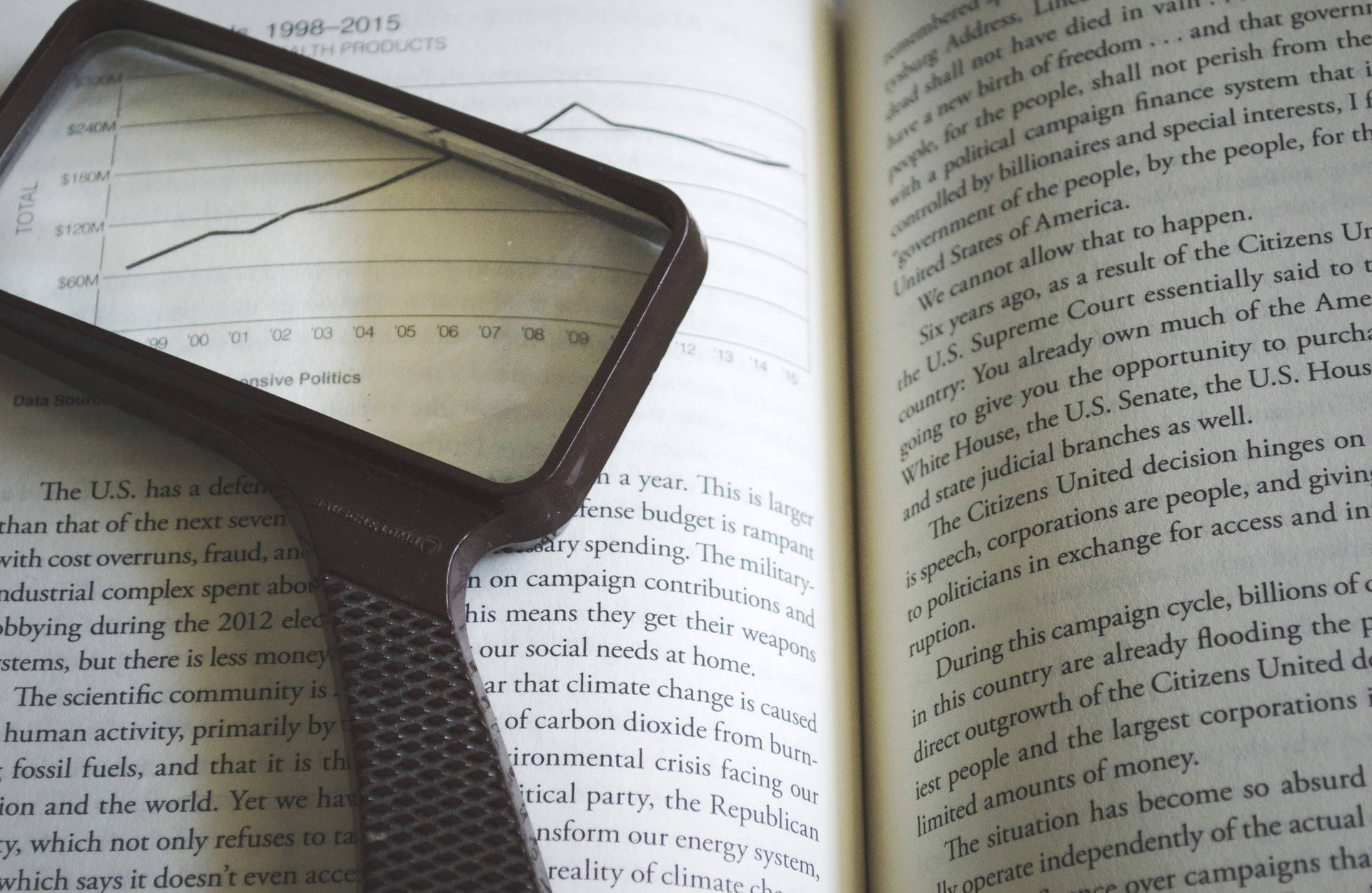 Reference Book With Magnifying Glass Background