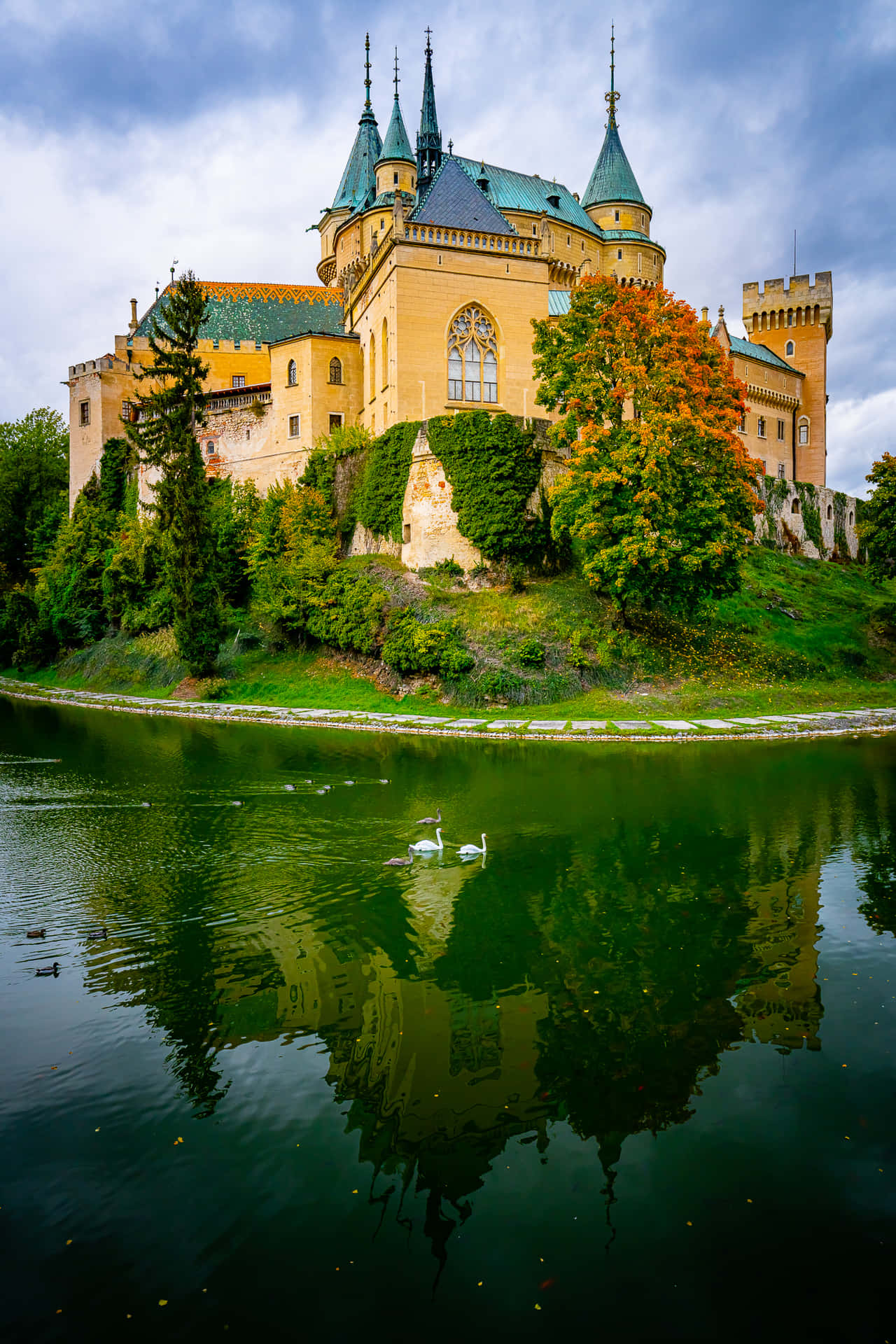 Reflection Of Colorful Bojnice Castle Background