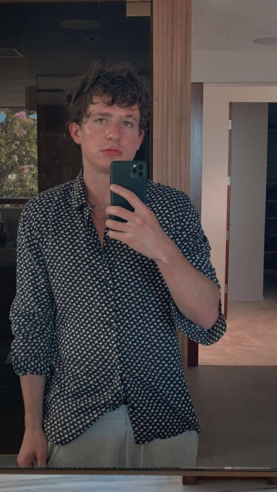 Reflective Gaze - Charlie Puth In The Mirror Background