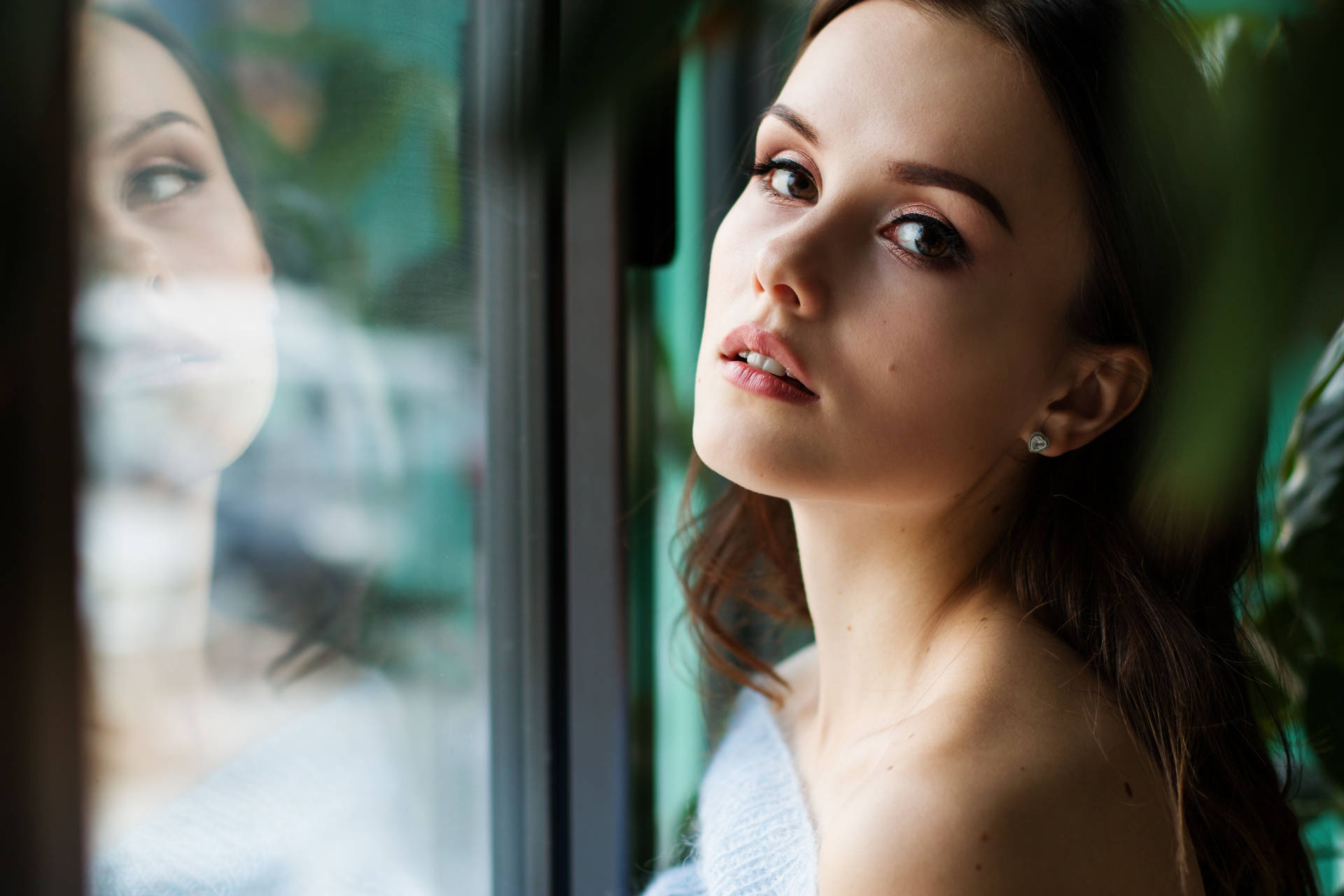 Reflective Mindset - Mature Woman Gazing Through The Window Background