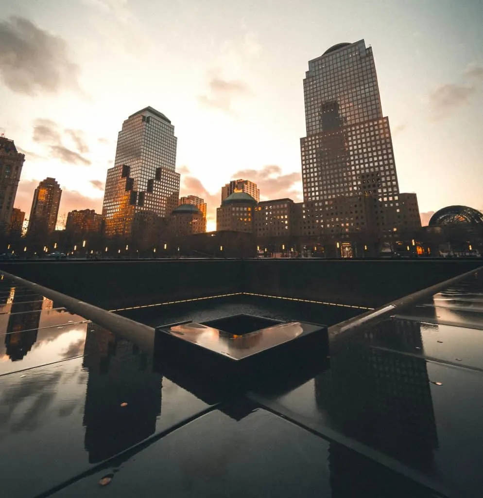 Reflective Serenity At Sunset - 9/11 Memorial Monument Background