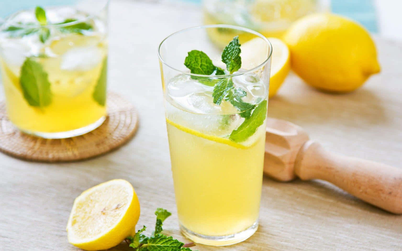 Refreshing Citrus Juice With Lemons And Mint Background