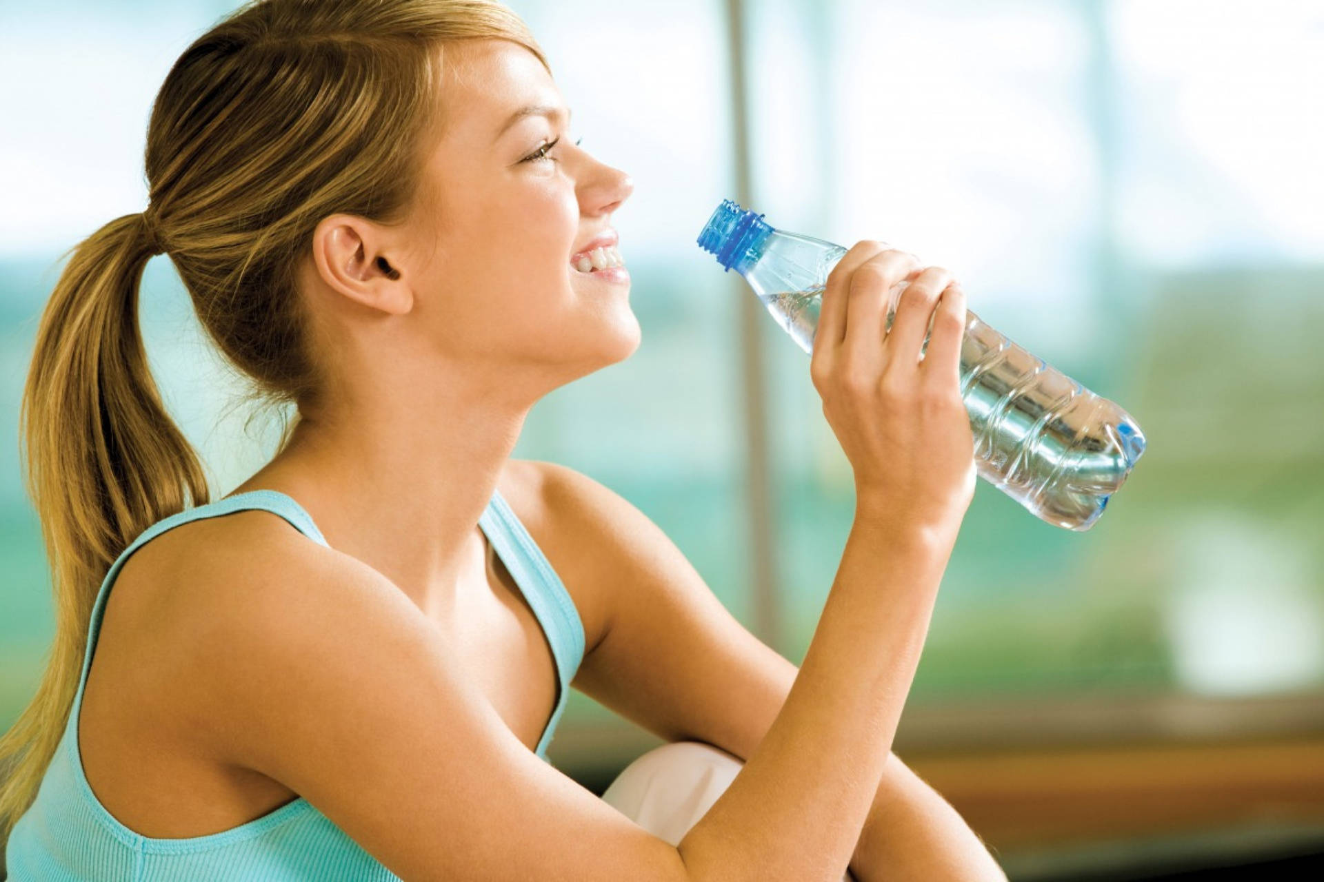 Refreshing Hydration - Woman Enjoying A Glass Of Clean Water